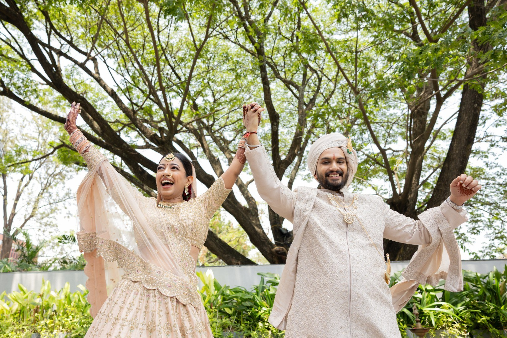 Hands in the Air: Chiranjeev & Niharika at Hyatt Centric Hebbal. Truly Yours | Documentary Wedding Photography & Films | Sharath Padaru, Bangalore