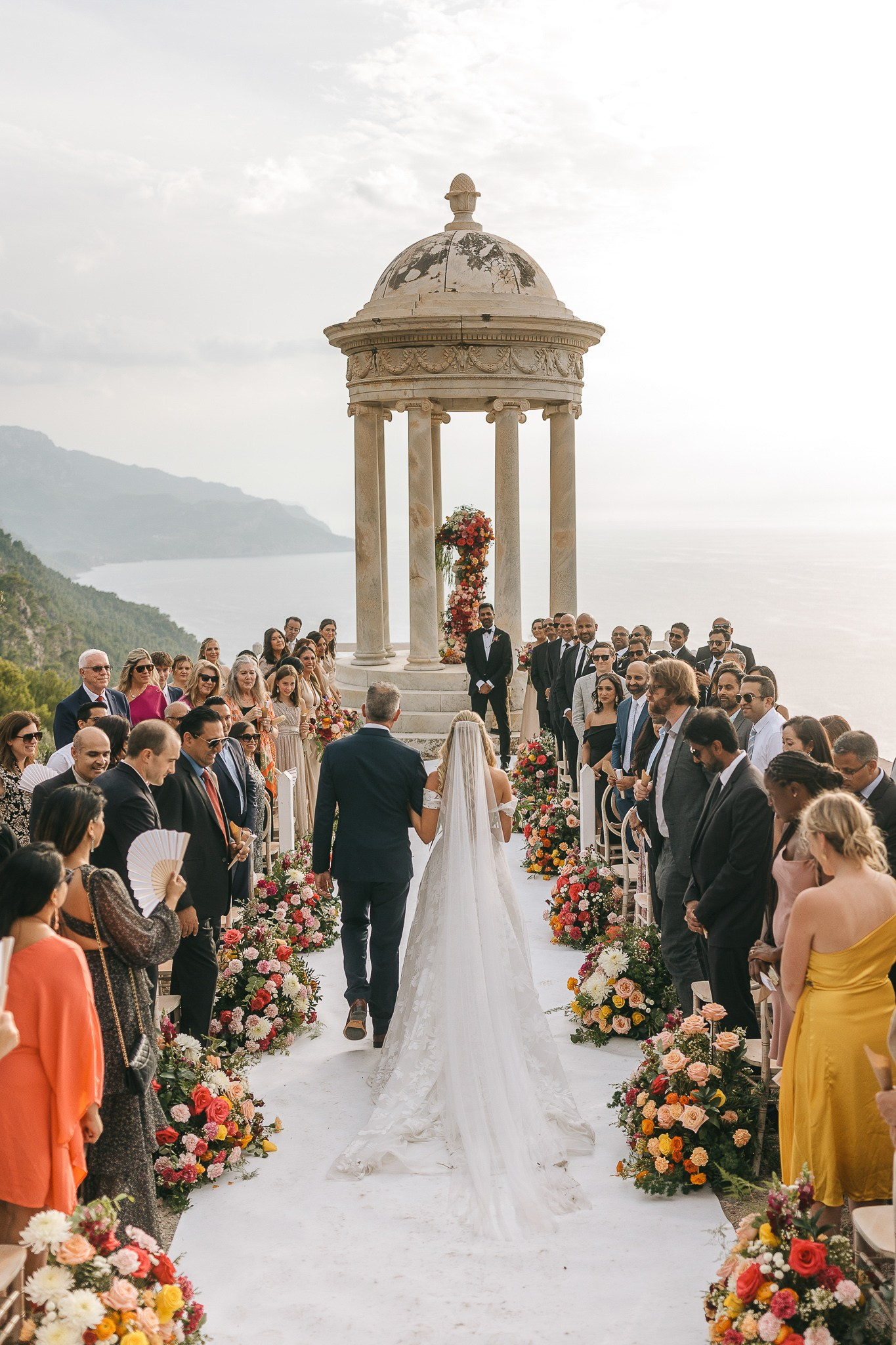 Bride walking down the aisle with her father at her destination wedding at Son Marroig