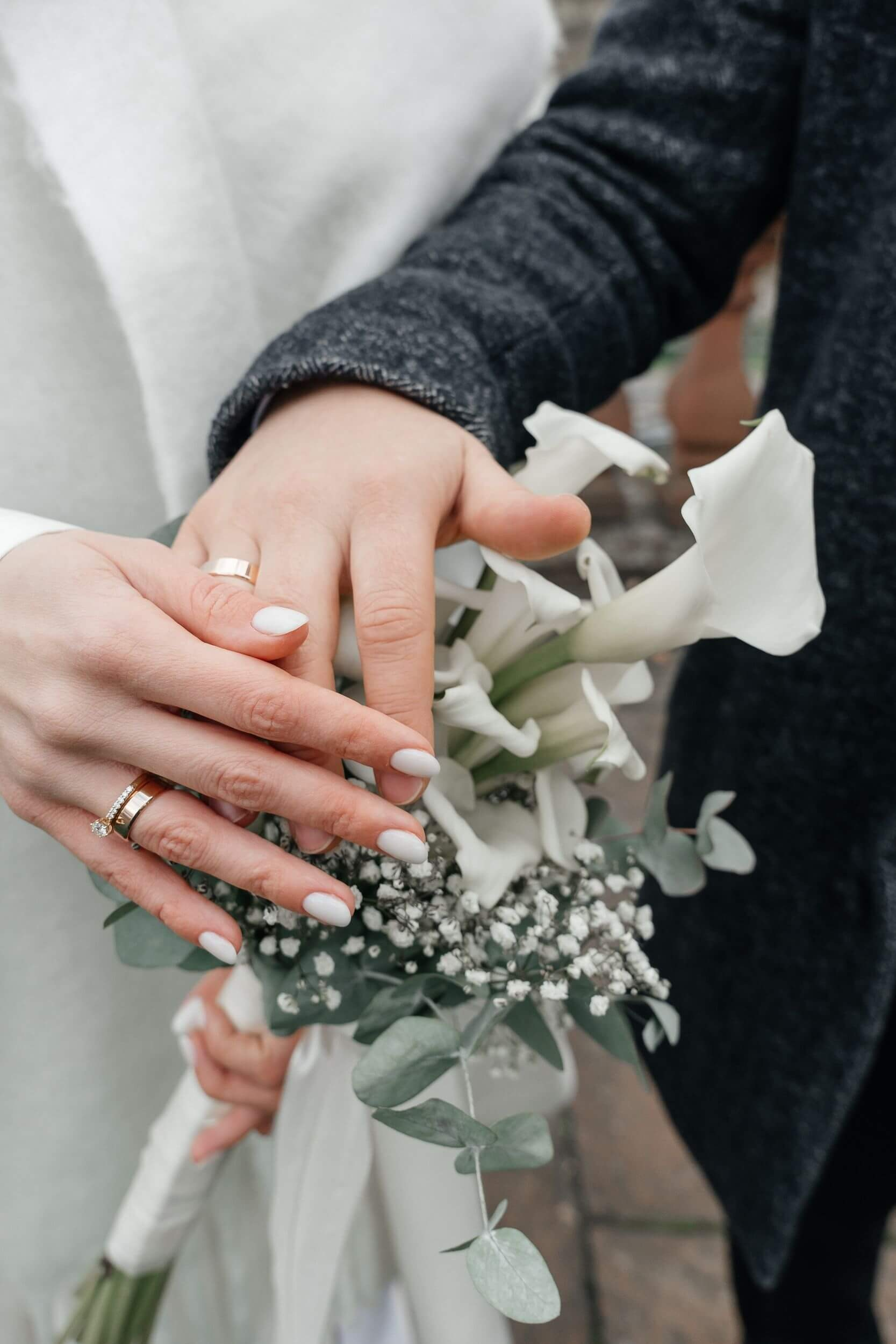 wedding rings and bouqet