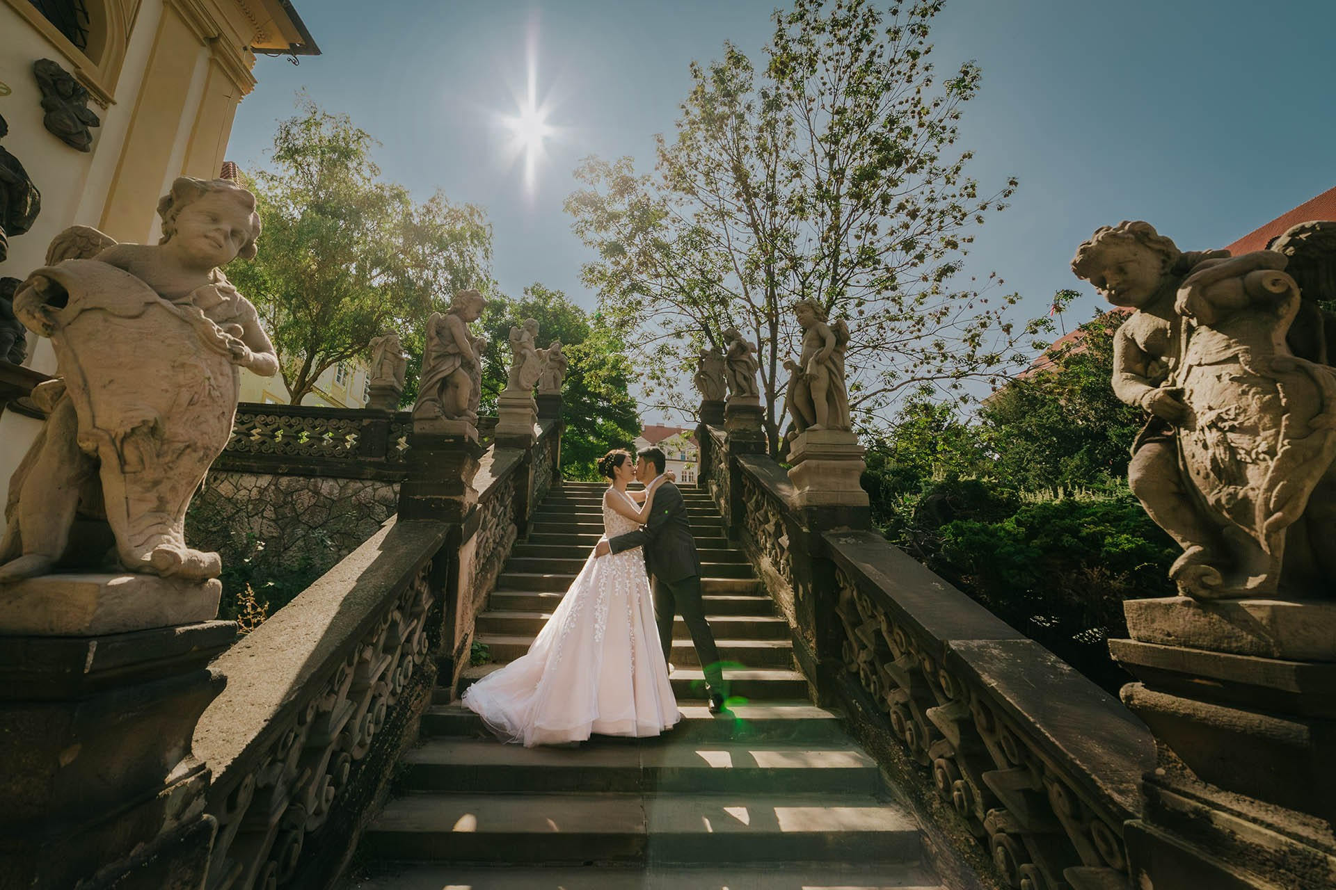 A Malaysian couple walking in the Royal Garden overlooking Prague.