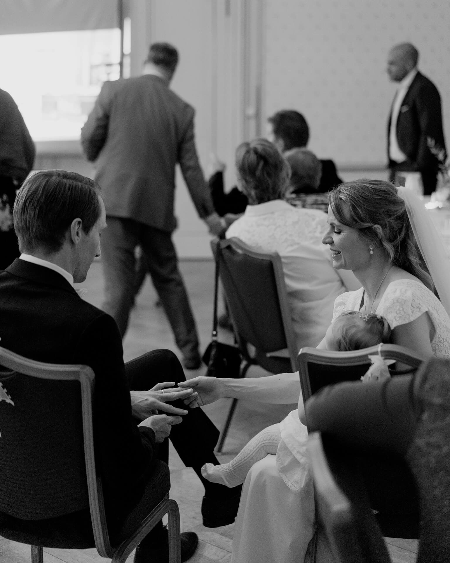 Black and white guests seated during wedding reception at Falkenstein Grand