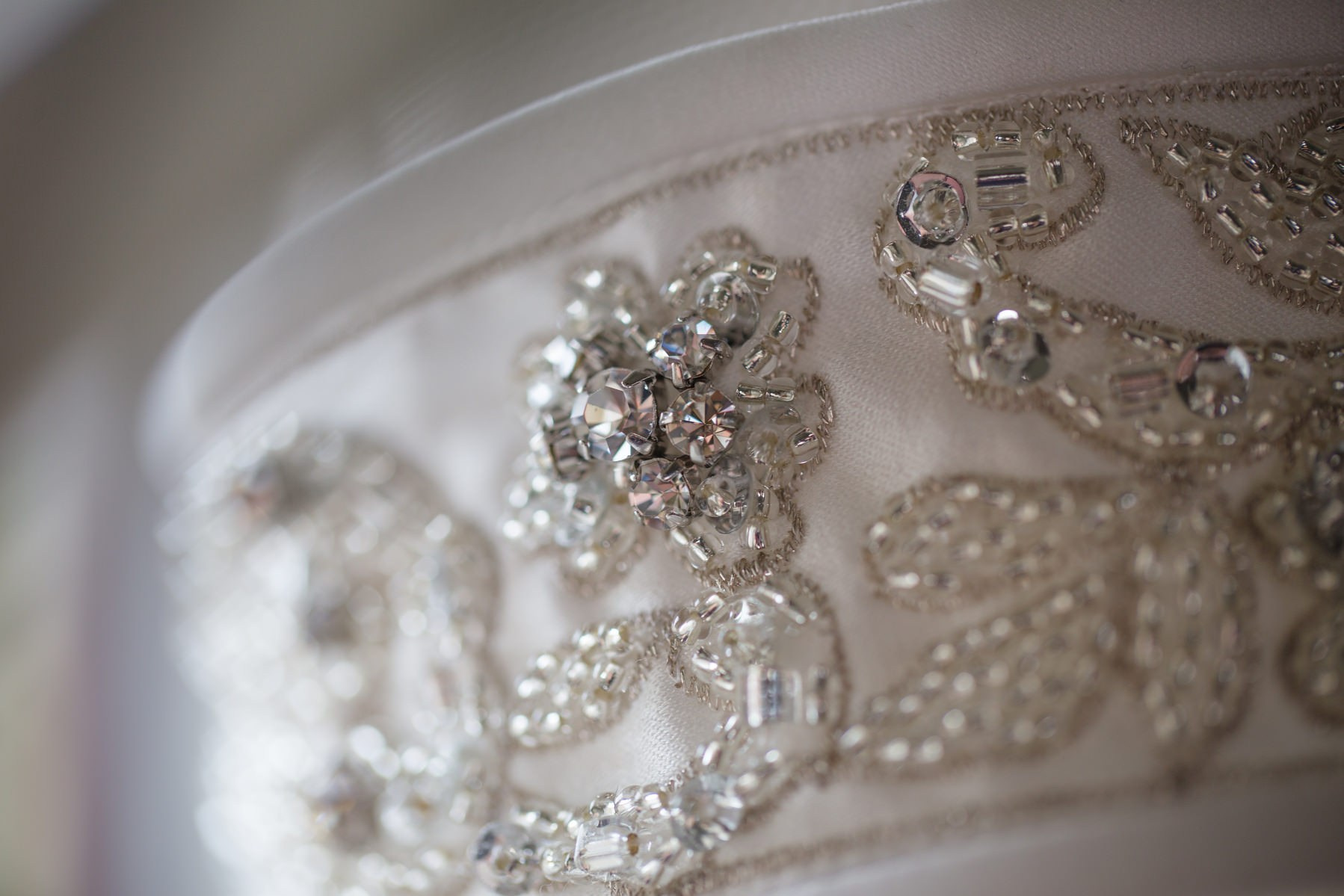 Close-up details of designer wedding dress lace and craftsmanship Prague luxury wedding