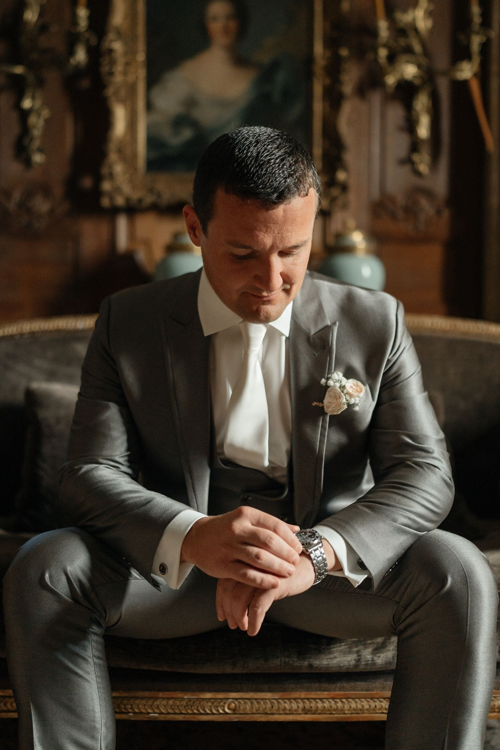 groom waiting for the bride at couch