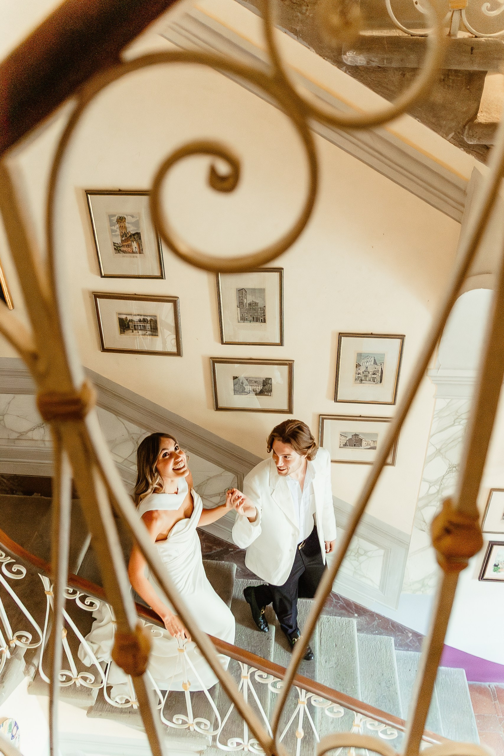 Couple walking on the stairs in a vintage villa near Lucca