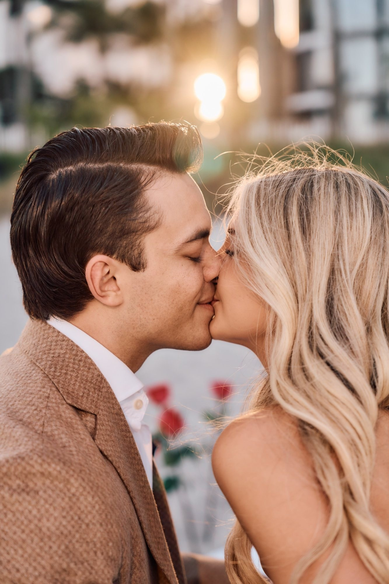 Sunset beach wedding photographer Miami — bride and groom first kiss at golden hour