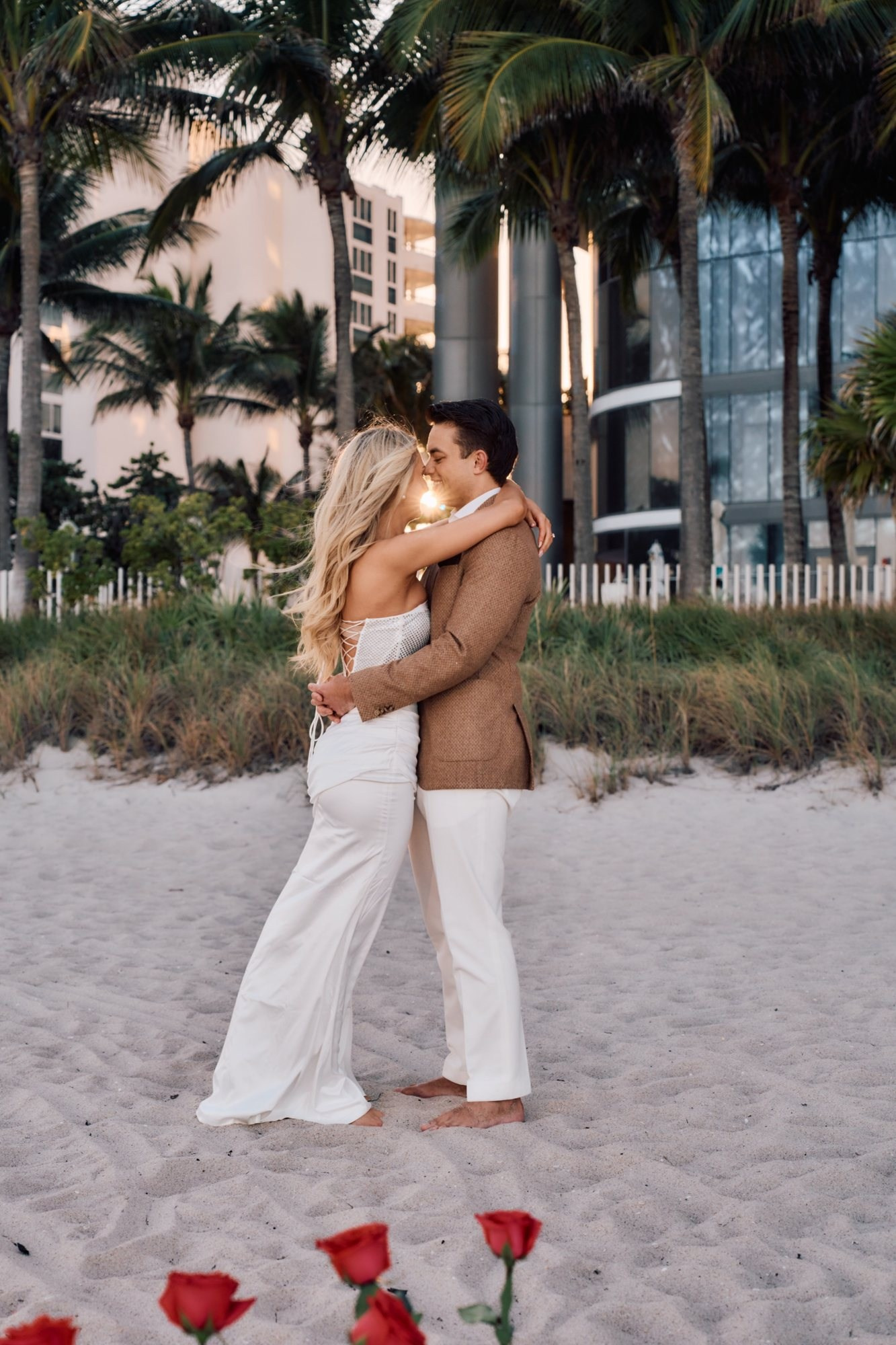Miami Beach elopement photographer — couple embracing barefoot on the sand