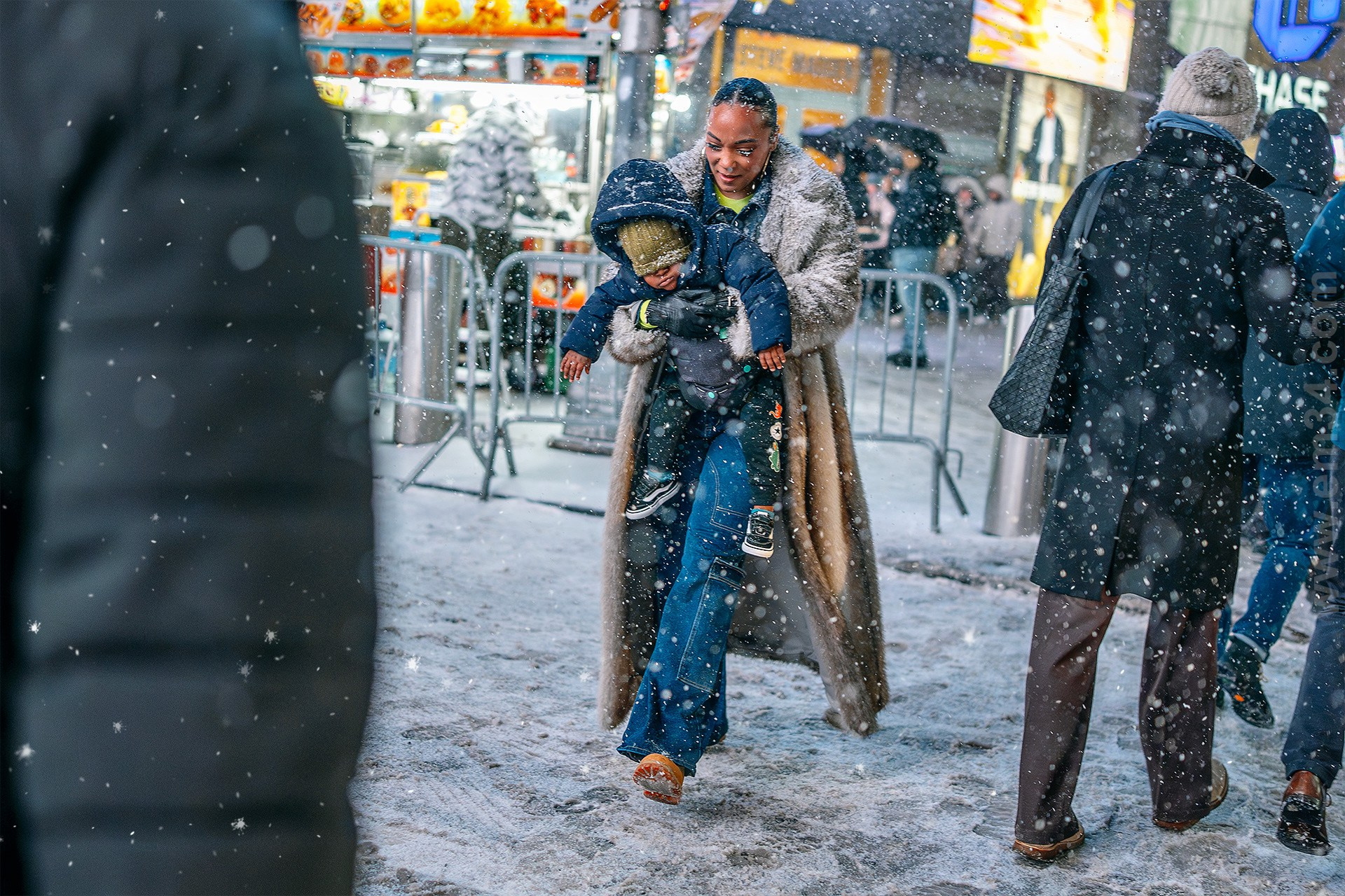 New York City Snowfall Street Photography — Night Winter Scenes Capturing Emotions, Reactions & Euphoria of Falling Snow. Emin Kuliyev — Award-Winning Wedding Photojournalist NYC & USA | Best Wedding Photographer Known for Candid, Timeless Moments