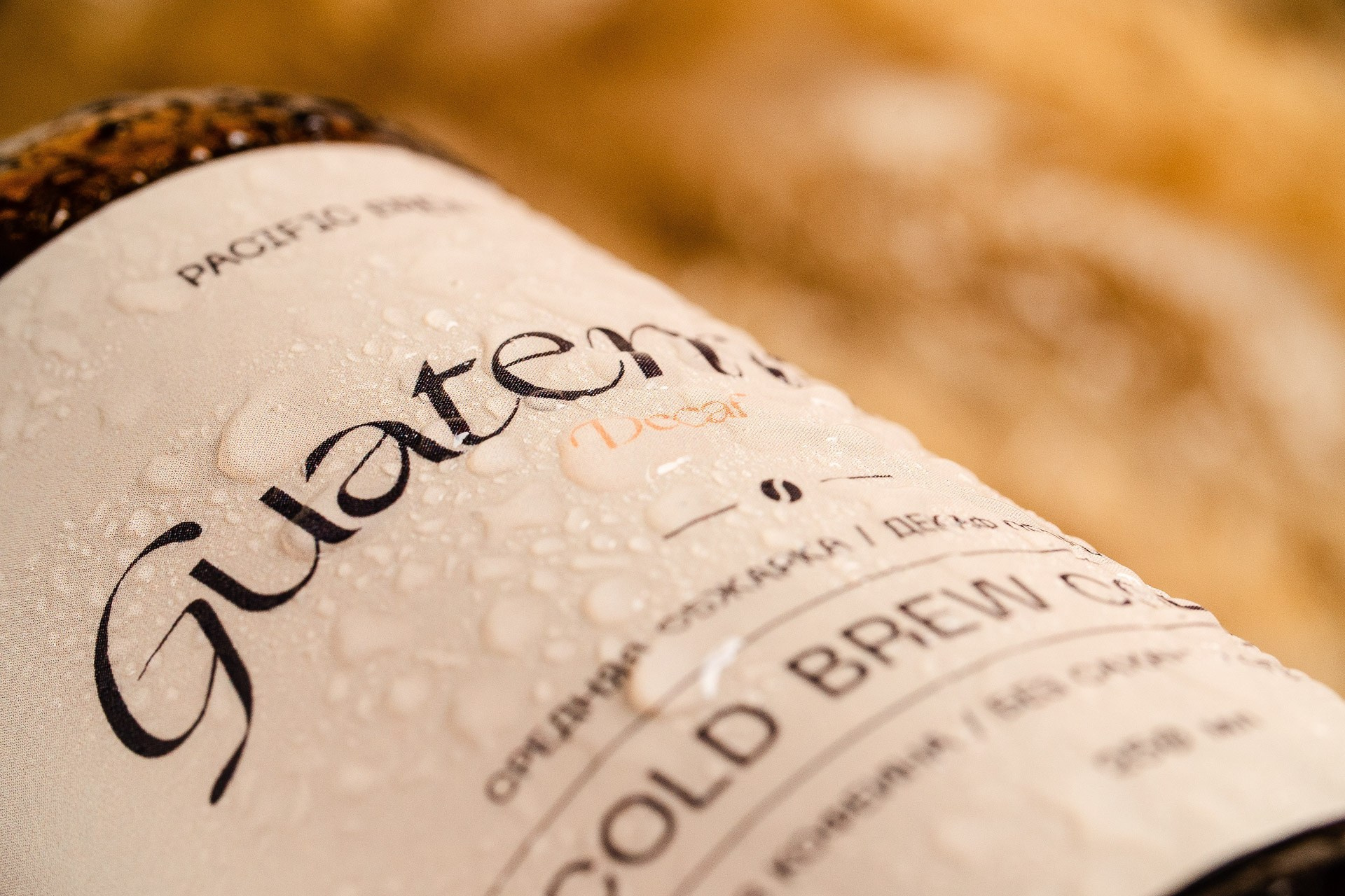 Close-up product detail of coffee bottle label, branding photography