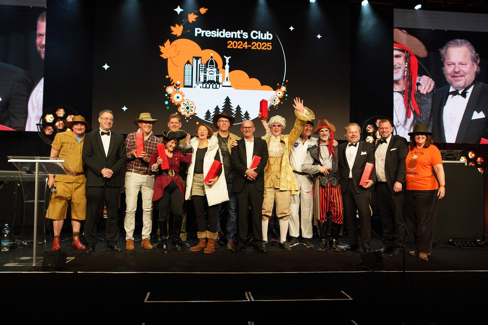 Group photo President's Club awardees on stage at Orange Business Sales Kick-Off 2026 adventure gala Hilton Prague.