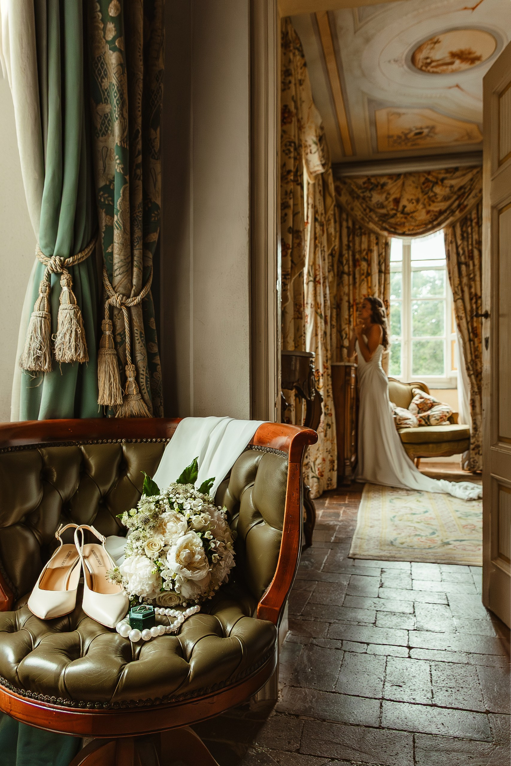 Bouquet, shoes and bridal rings on the chair