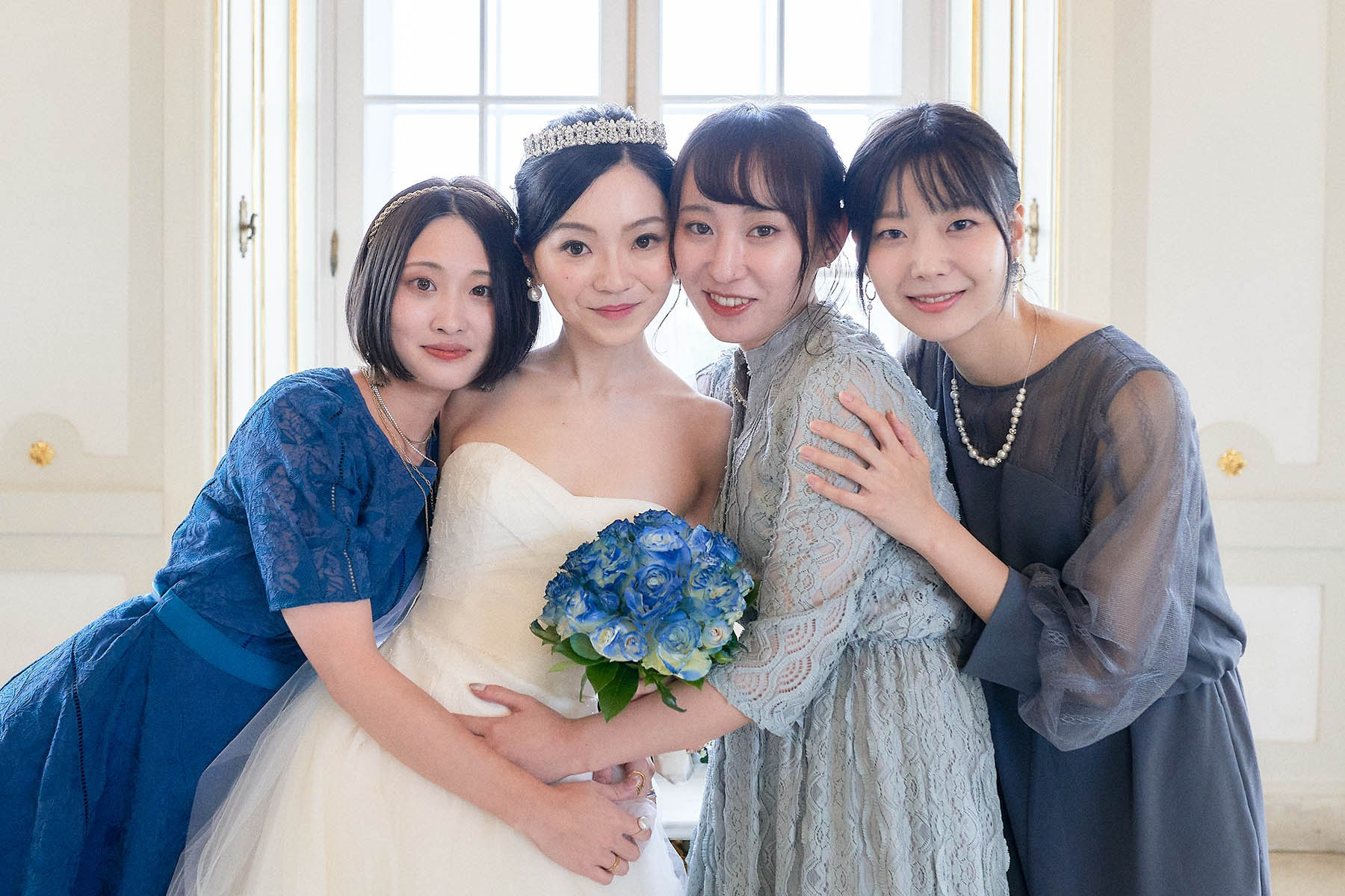 Hitomi and friends snuggle up for a happy photo.