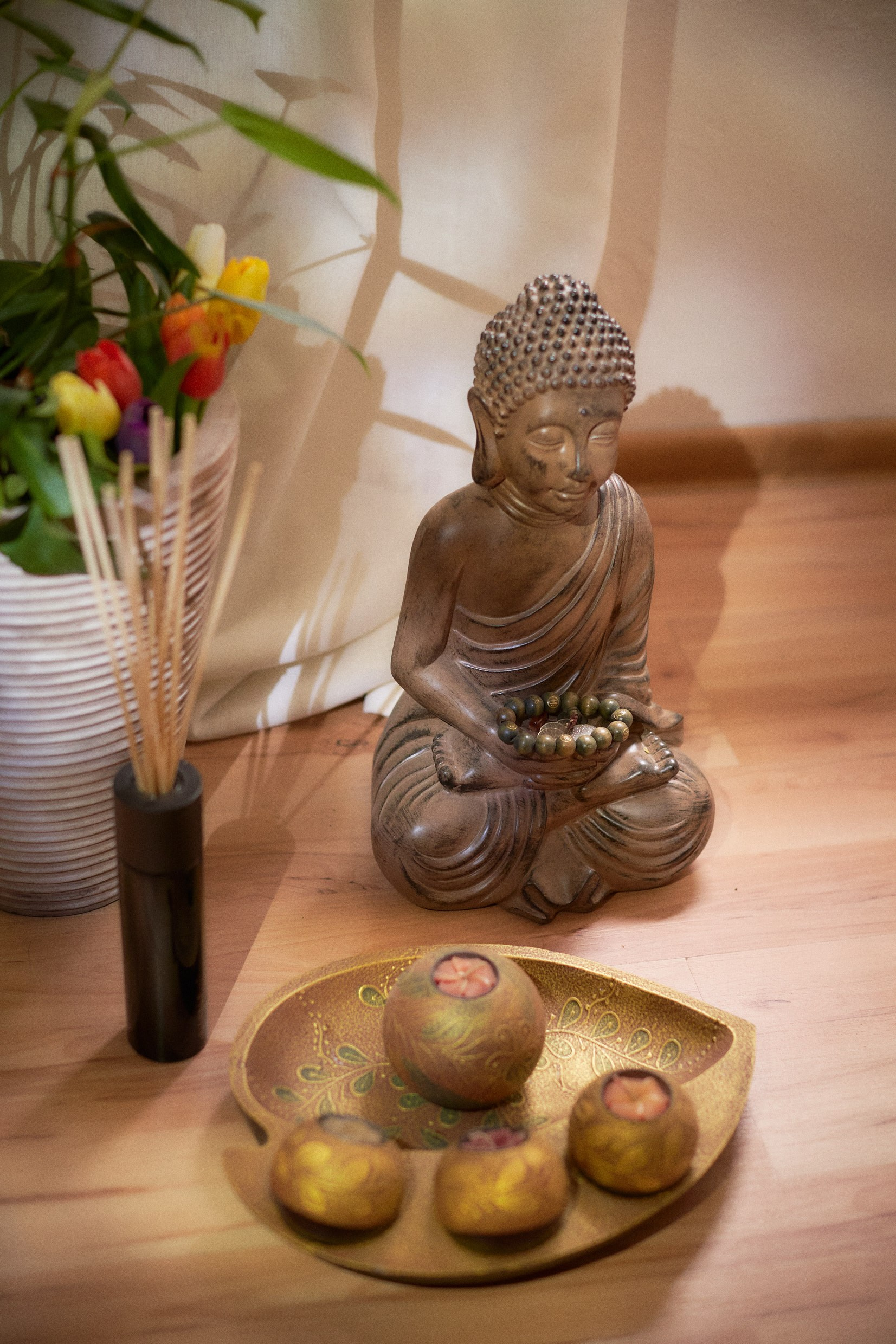 Tranquil Buddha statue decor in groom's sophisticated Prague suite.