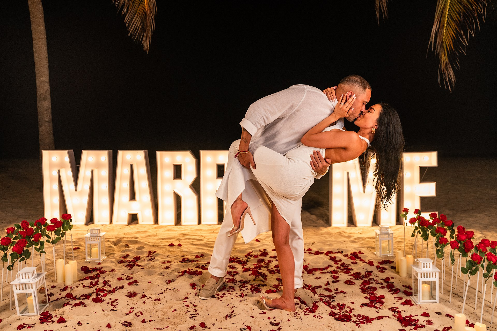 Path of Roses Leading to Large Glowing 'Marry Me' Letters