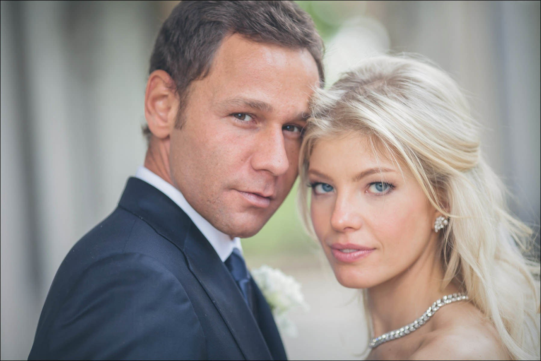 Confident pose of newlyweds looking at camera Belvedere Prague
