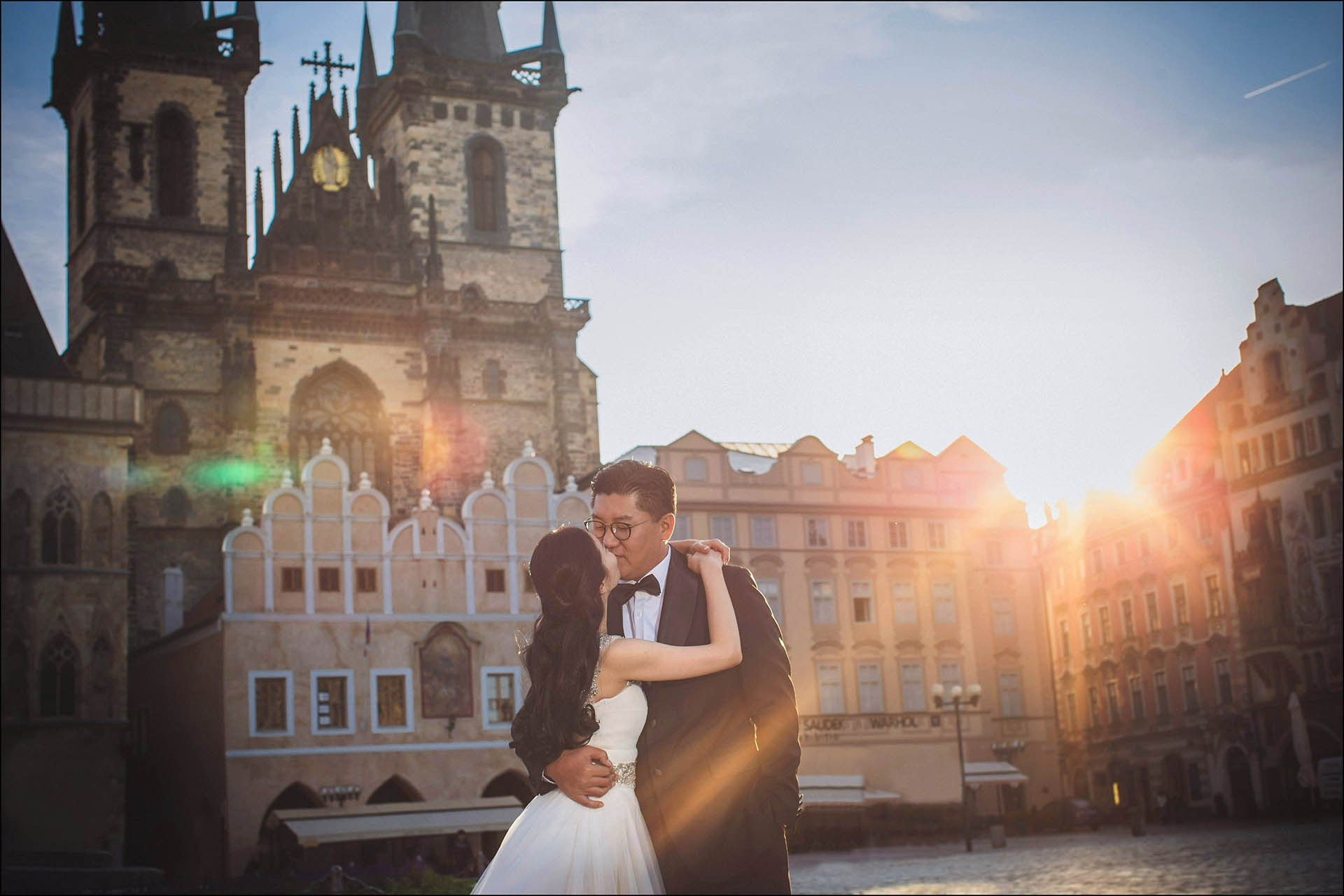 Cedric Son tender embrace Catherine sun flare Prague portrait.