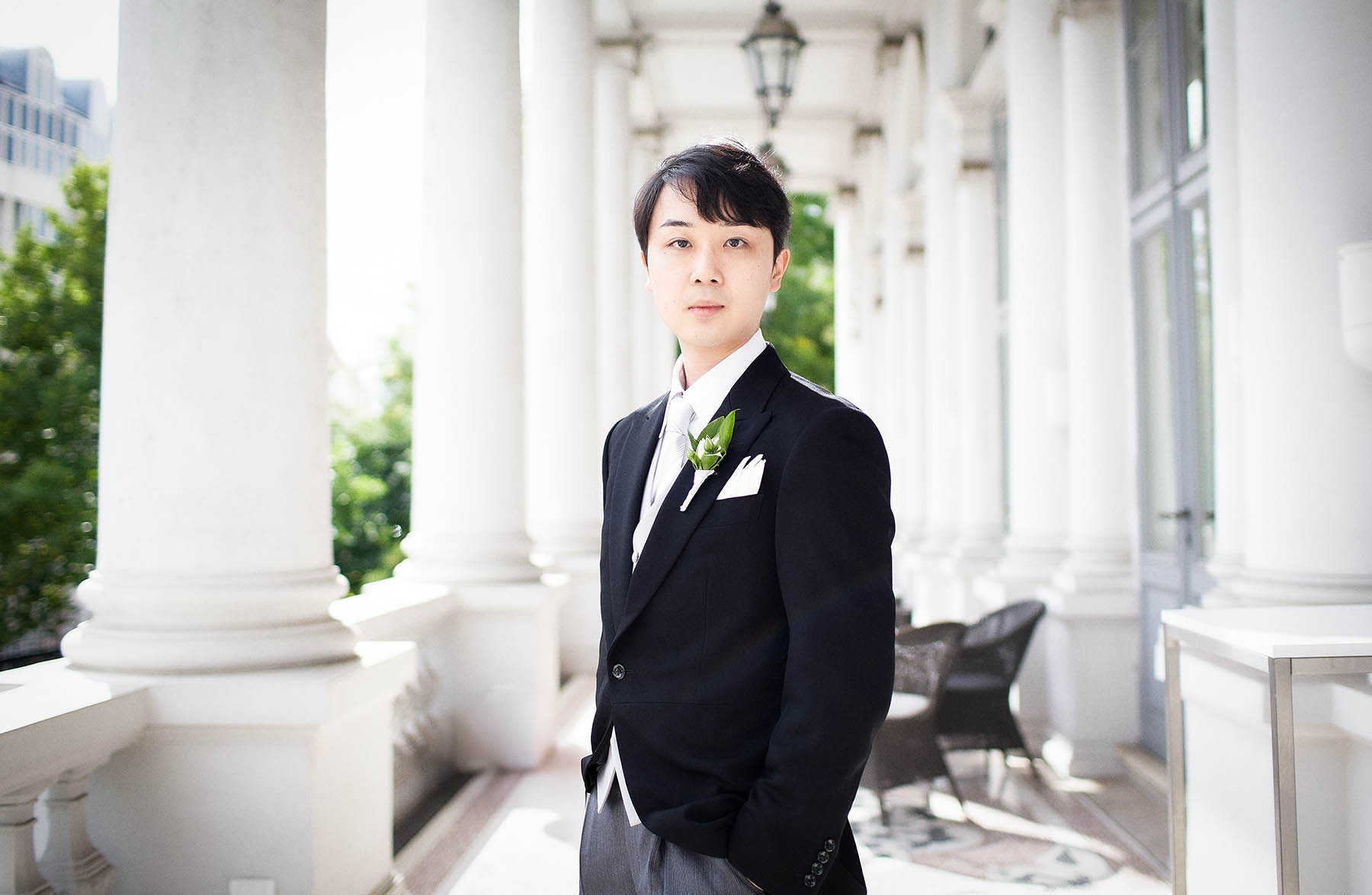 Groom portrait on balcony at Palais Coburg Vienna.