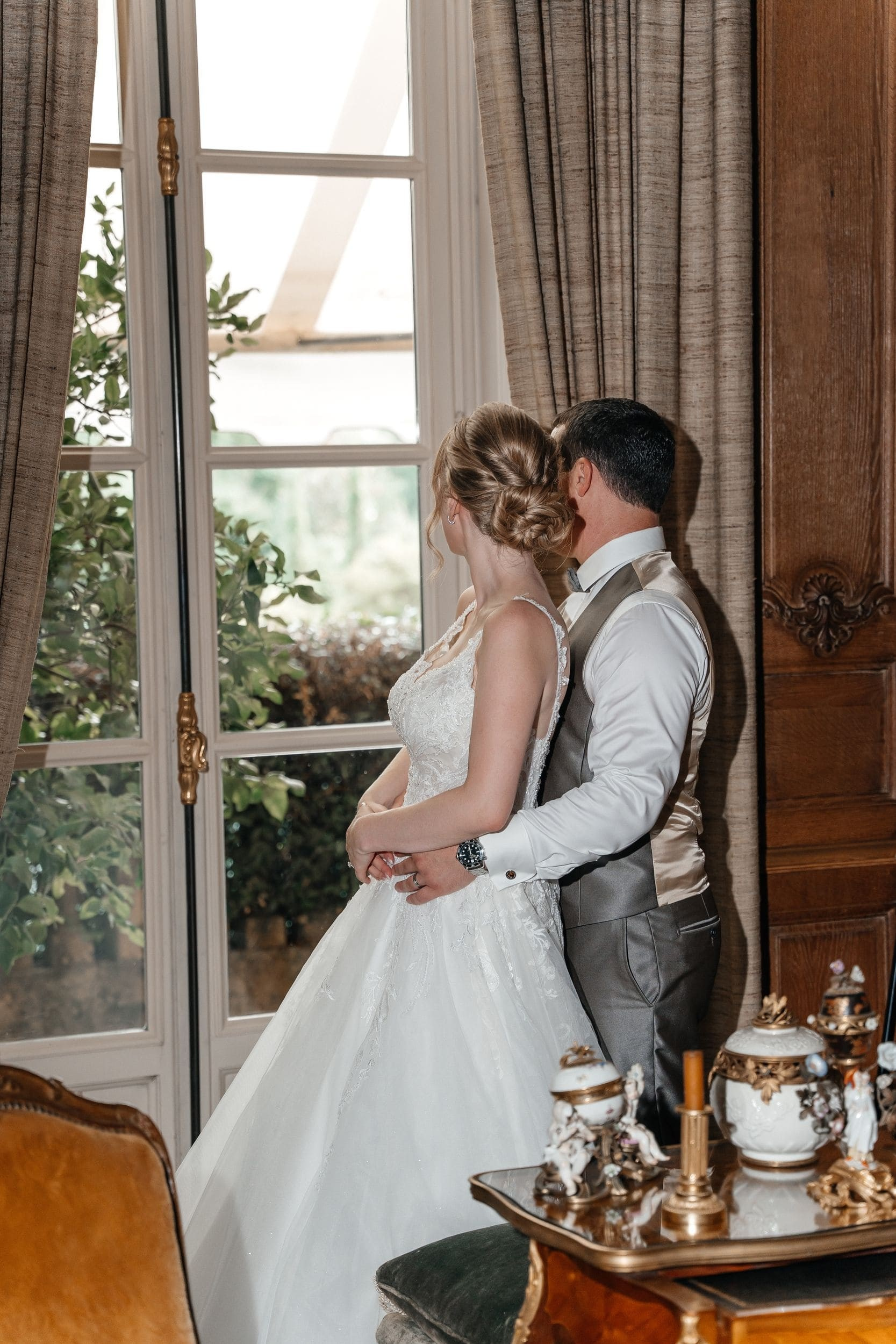 bride and groom looking out of the window