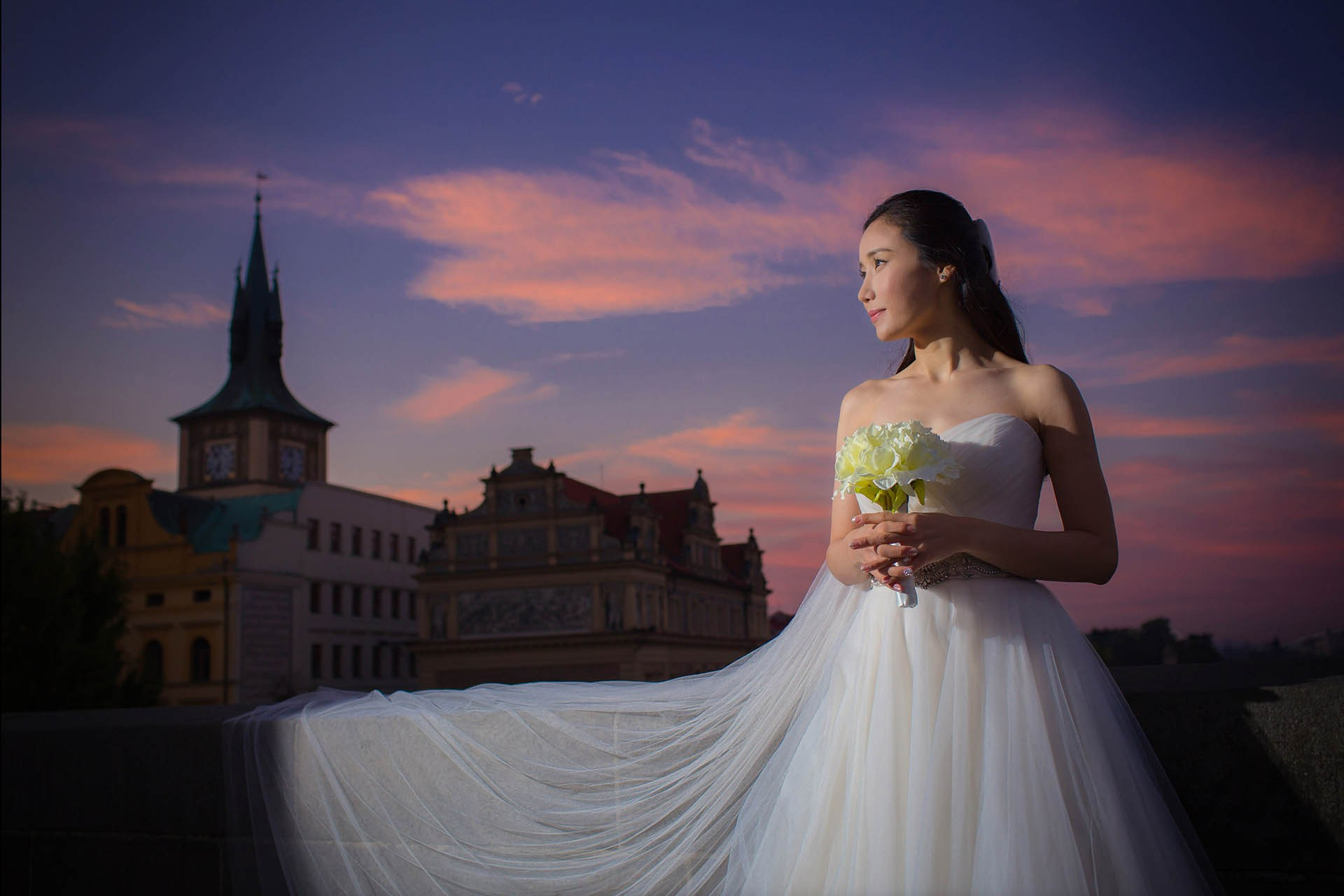 Catherine veil bouquet historic stones Charles Bridge dawn Prague wedding portrait.