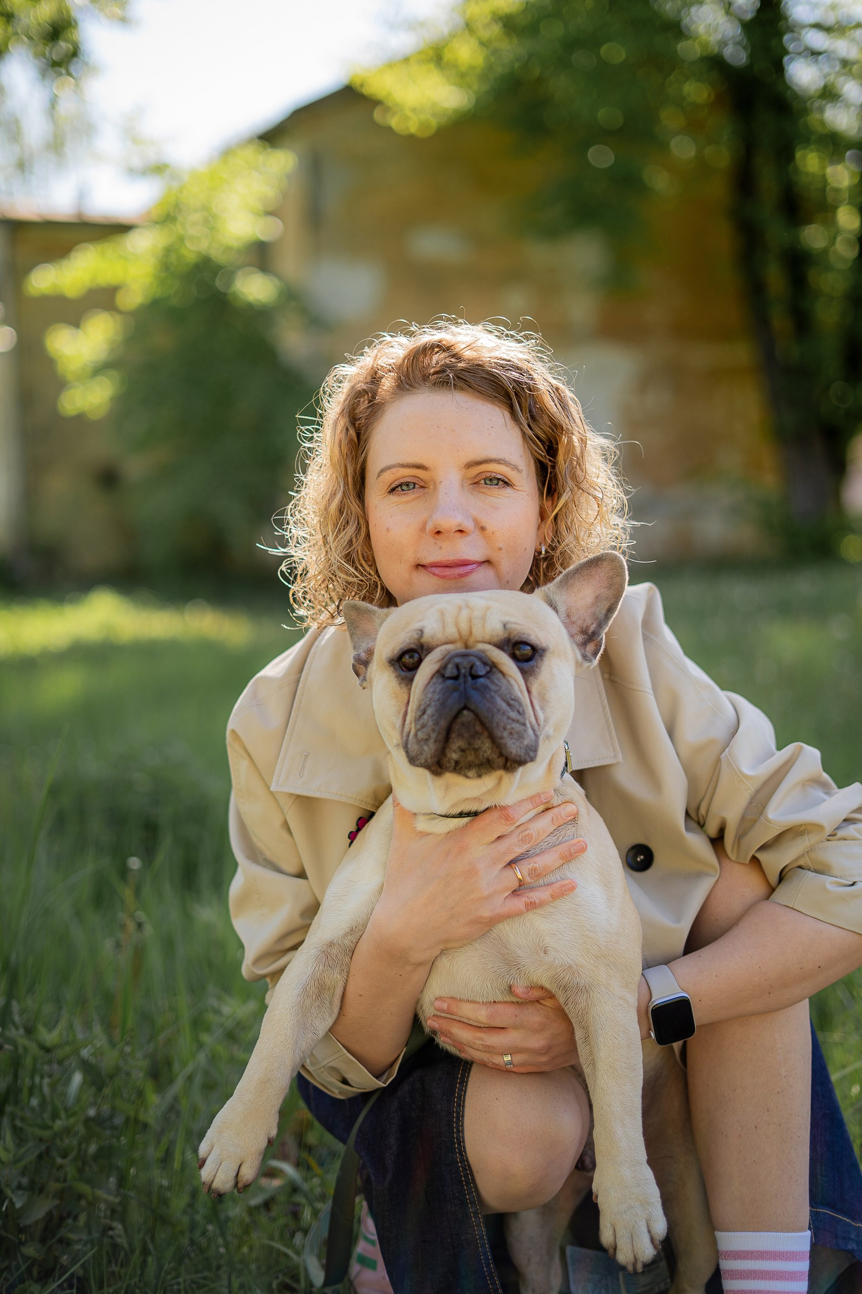 Woman with a dog on the beautiful street, family photographer Riga