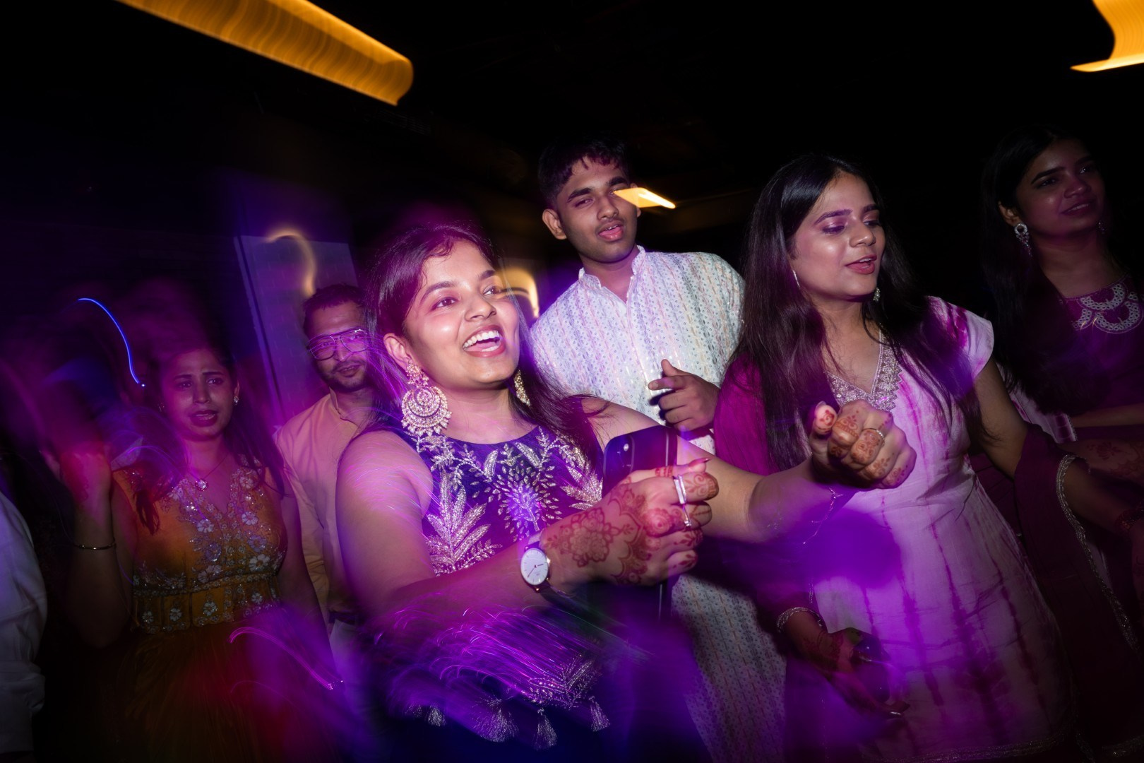 Hands in the Air: Chiranjeev & Niharika at Hyatt Centric Hebbal. Truly Yours | Documentary Wedding Photography & Films | Sharath Padaru, Bangalore
