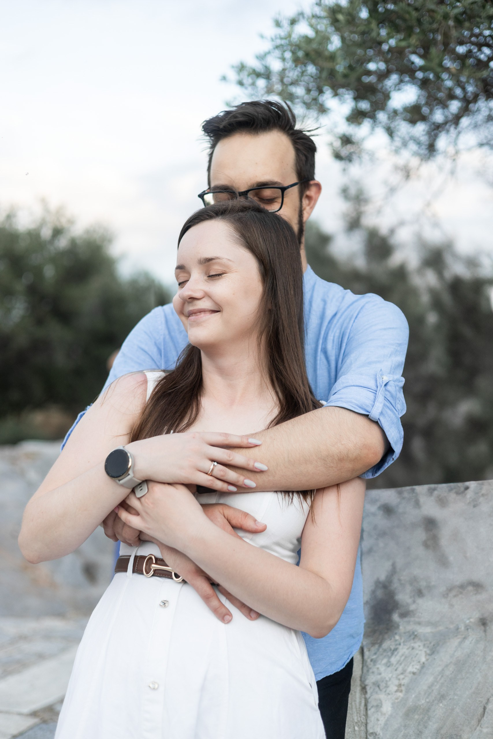 Bride embracing her husband during their honeymoon photoshoot