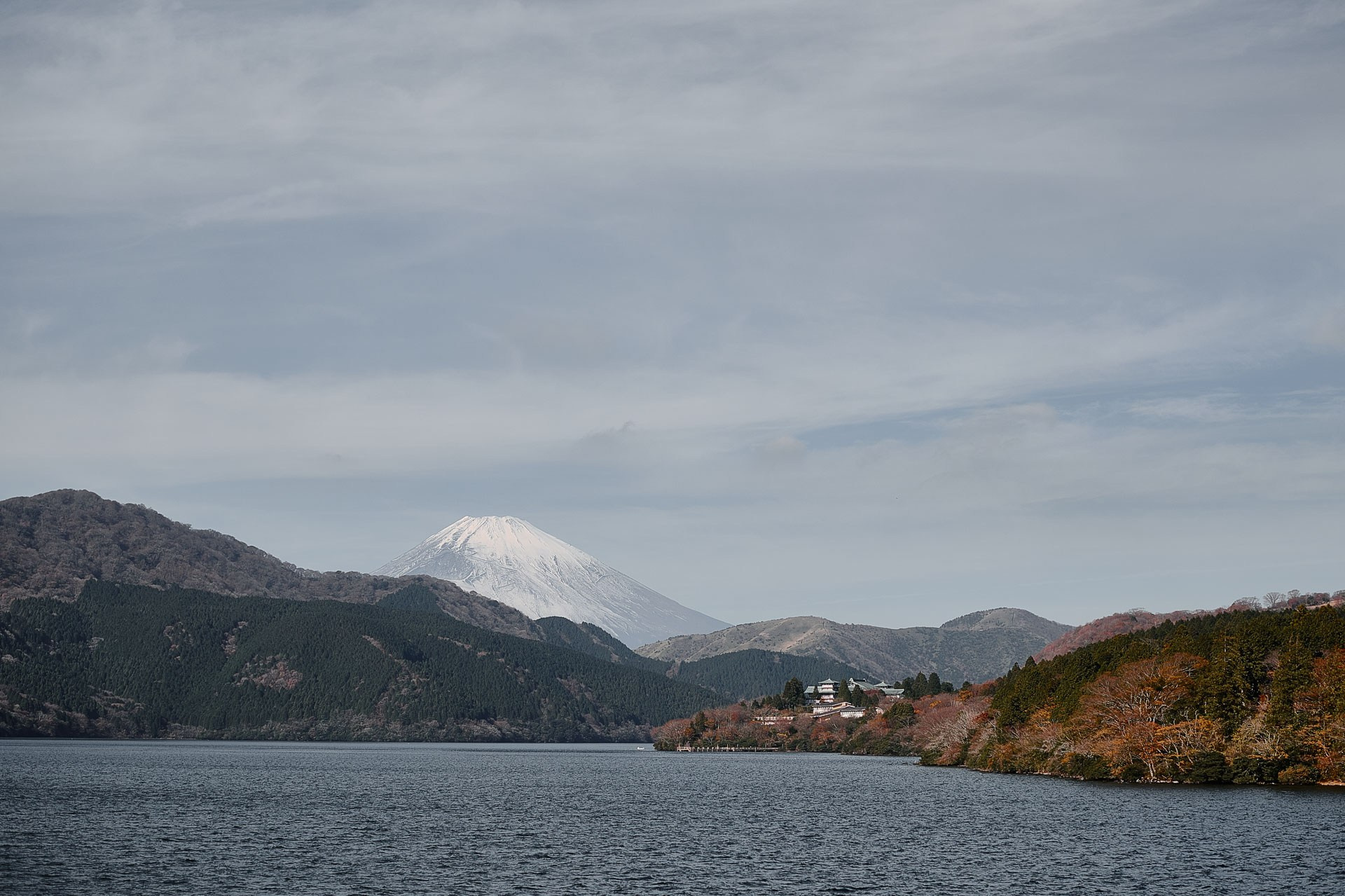 Lake Ashi with Mount Fuji reflected in the water on a clear day in Hakone, Japan.