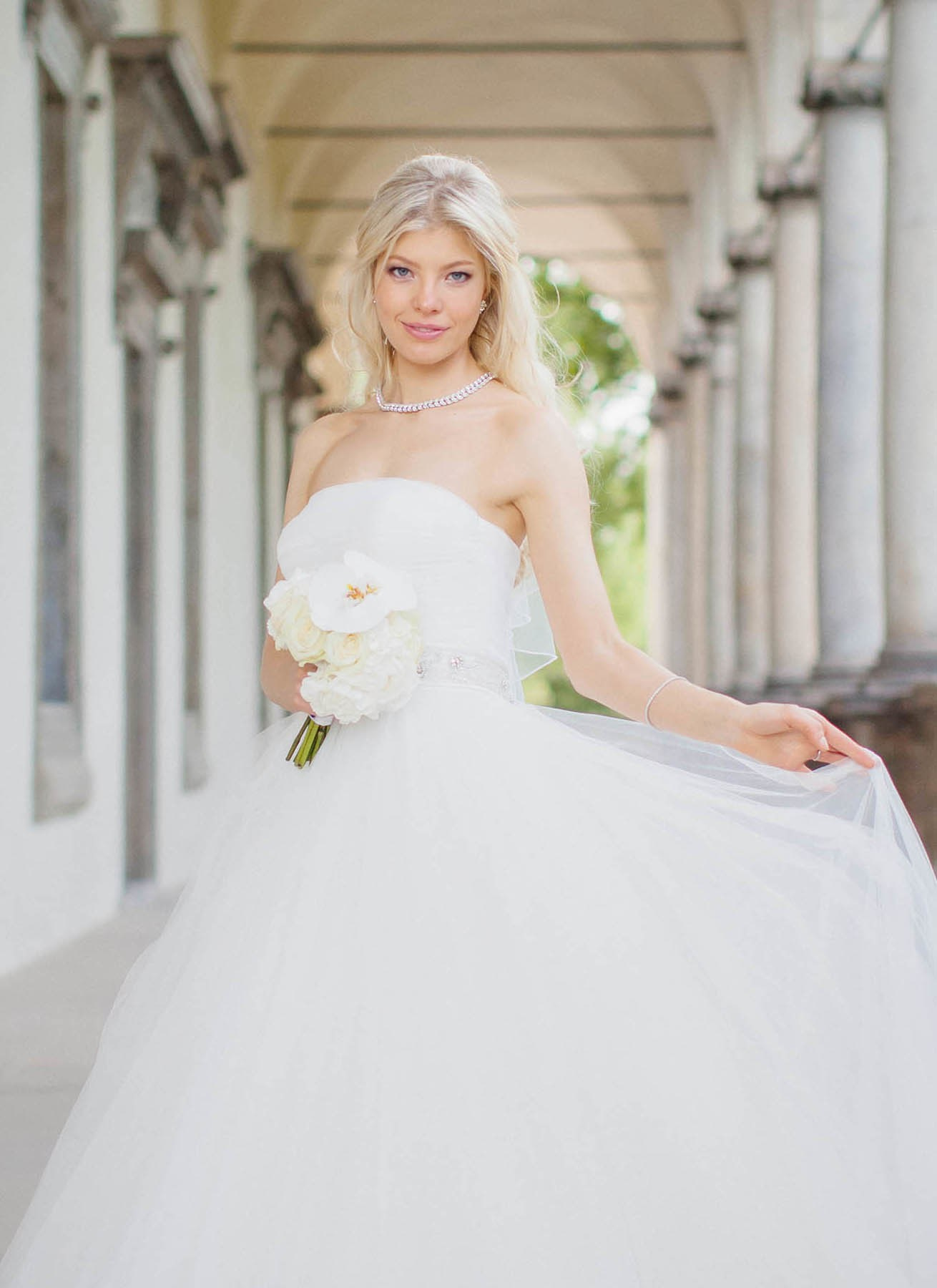 Portrait of radiant bride in designer gown Prague wedding