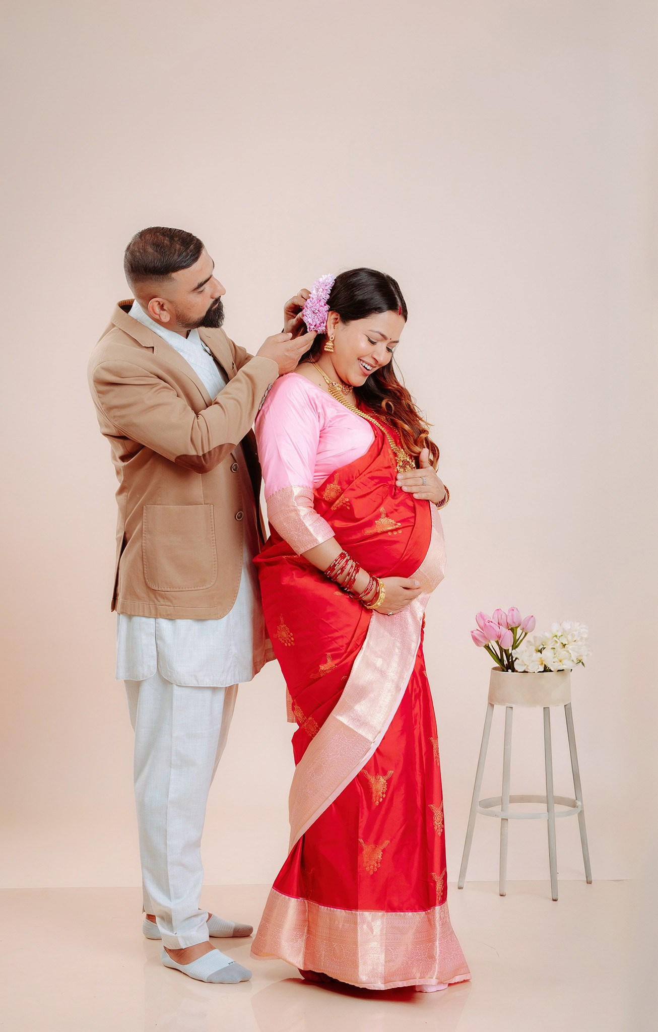 Elegant picture of couple at maternity photo session.