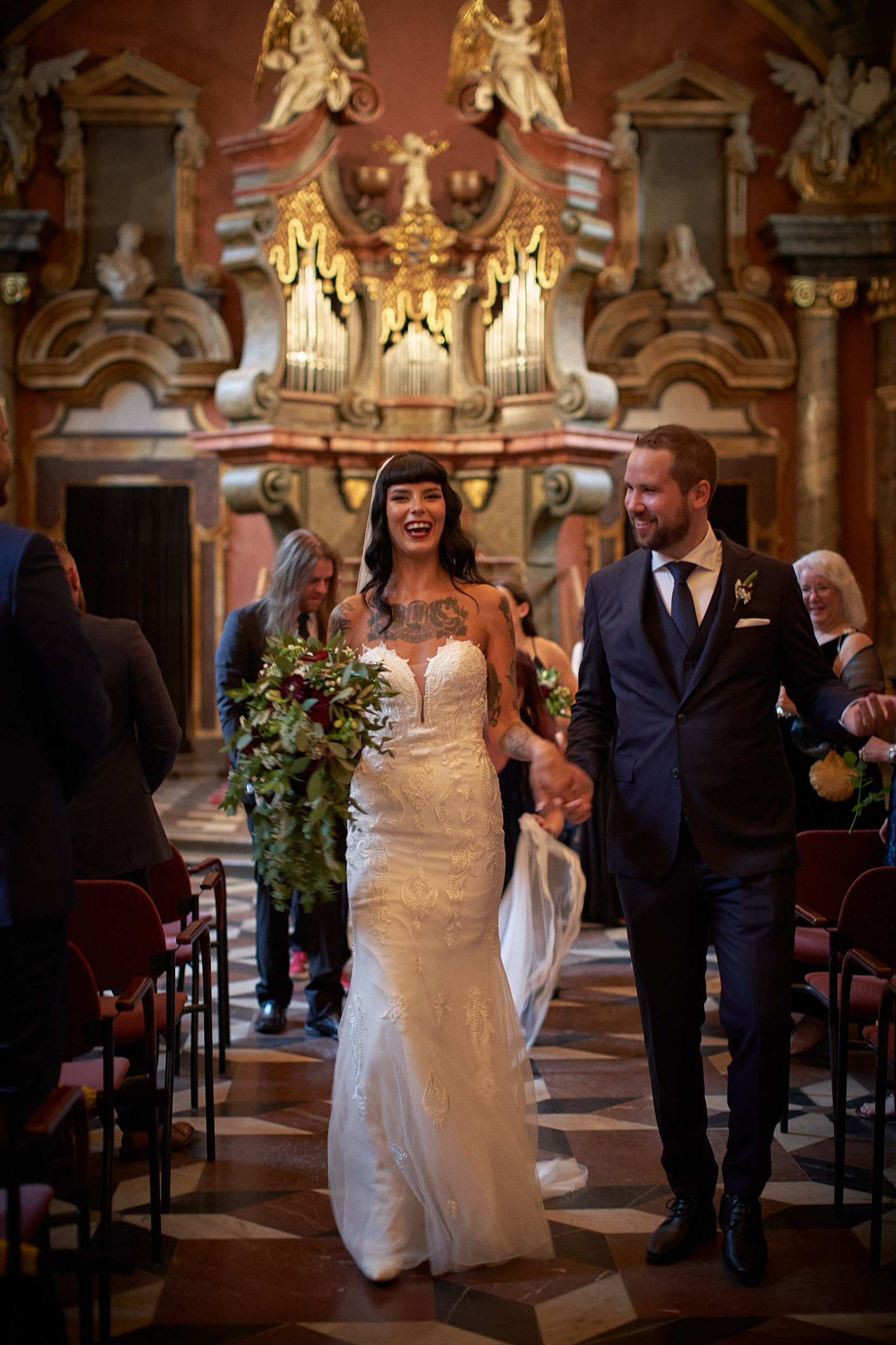 Courtney and Dean walking aisle as husband and wife post-vows.