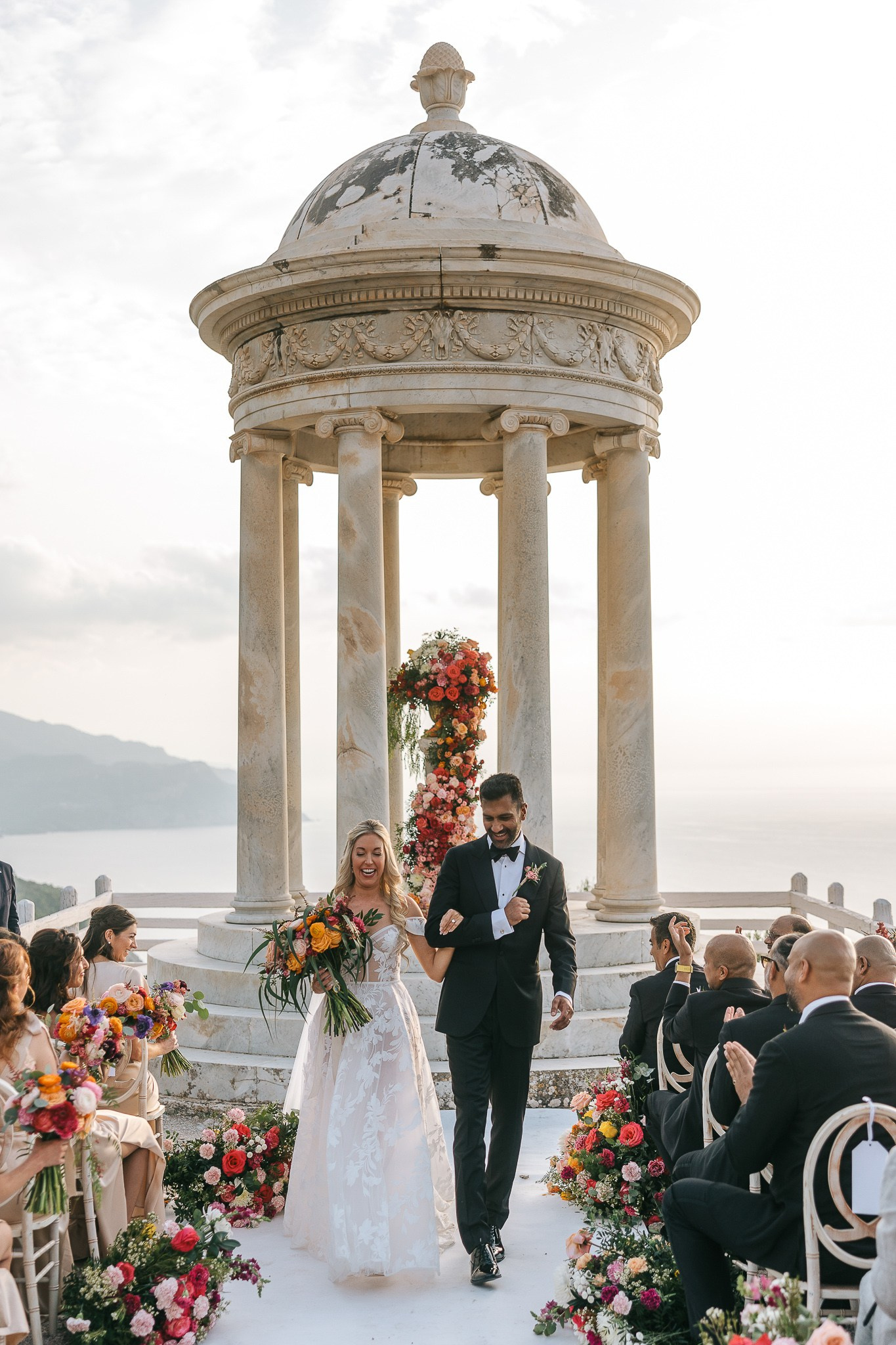 Bride and groom walking back down the aisle after their wedding ceremony at Son Marroig