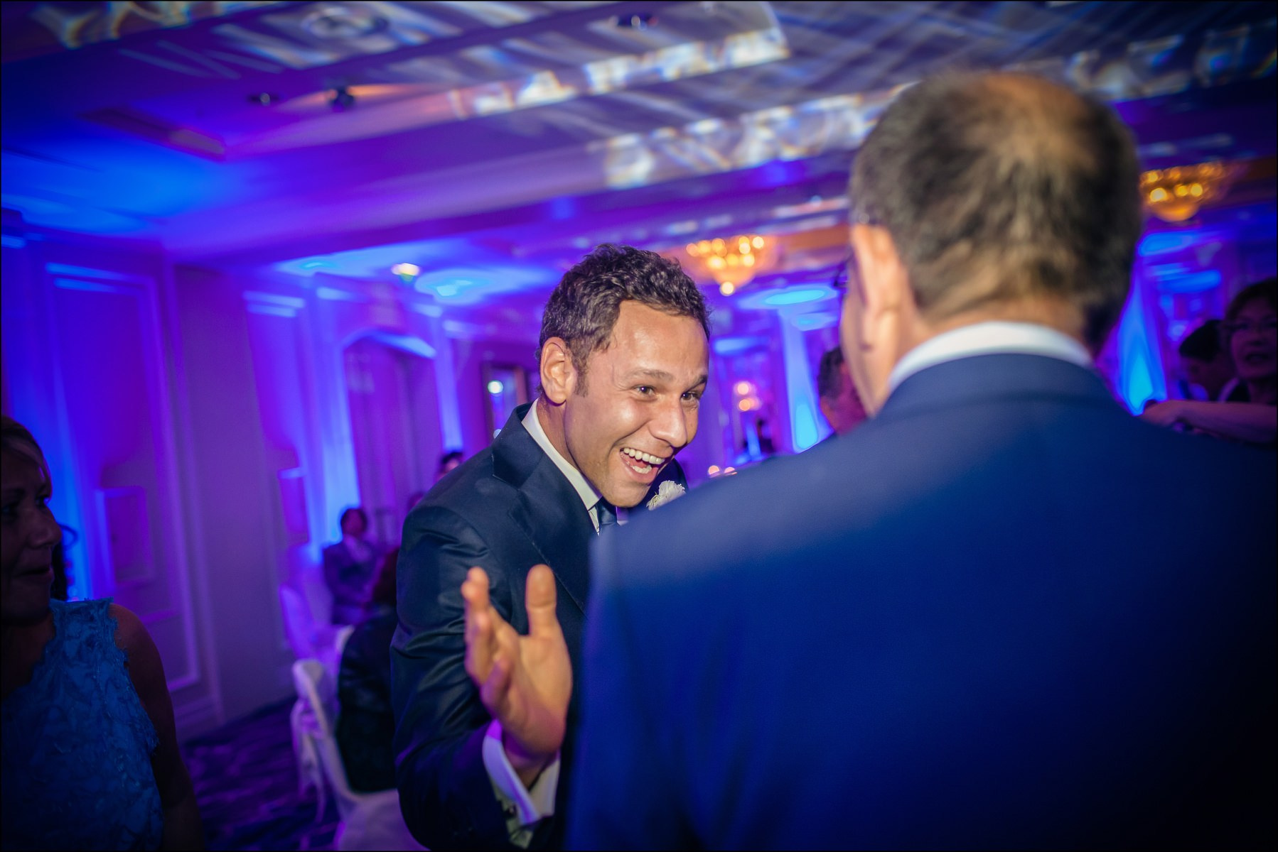 Groom congratulated by guests luxury reception Four Seasons Prague