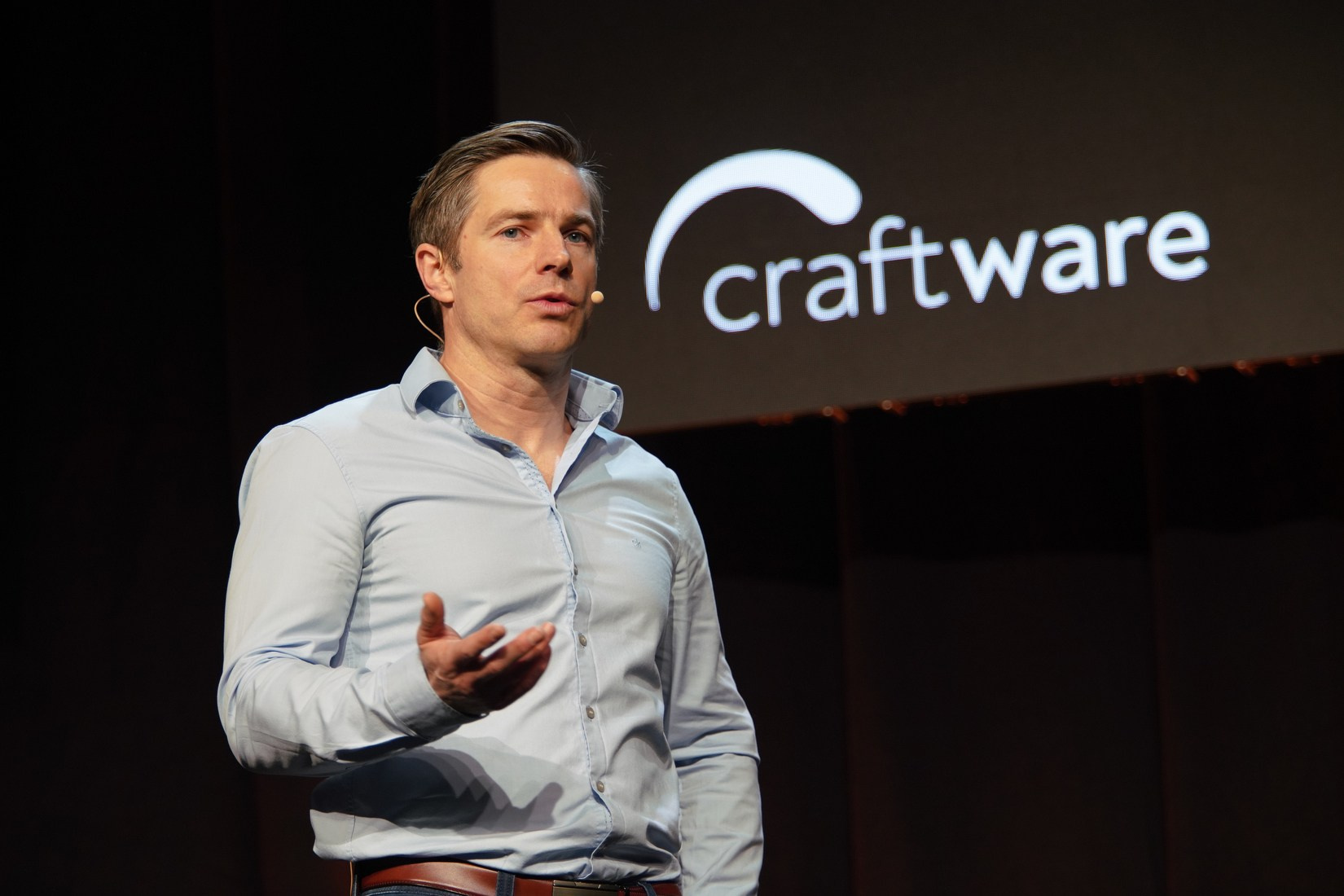 Jacek Zawlocki CEO Craftware speaking on stage at Orange Business Sales Kick-Off 2026 Hilton Prague.