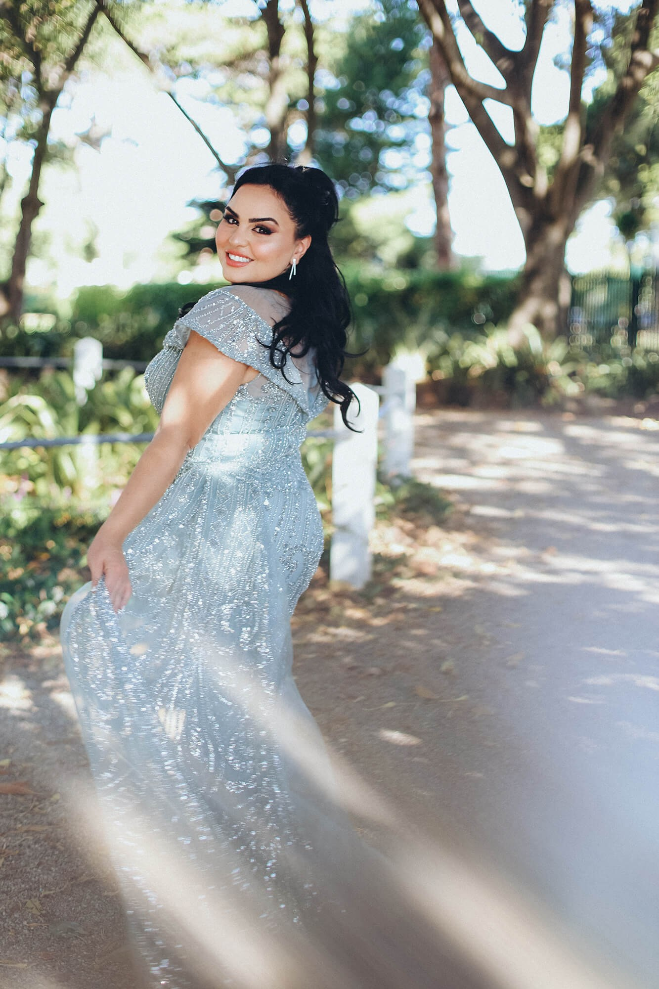 A groom’s emotional first look at his bride in a lush Melbourne garden wedding, captured in a candid and heartfelt photography moment.
