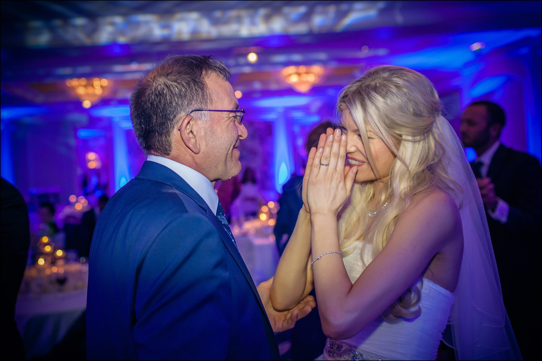 Bride thanking father gesture during wedding festivities Prague