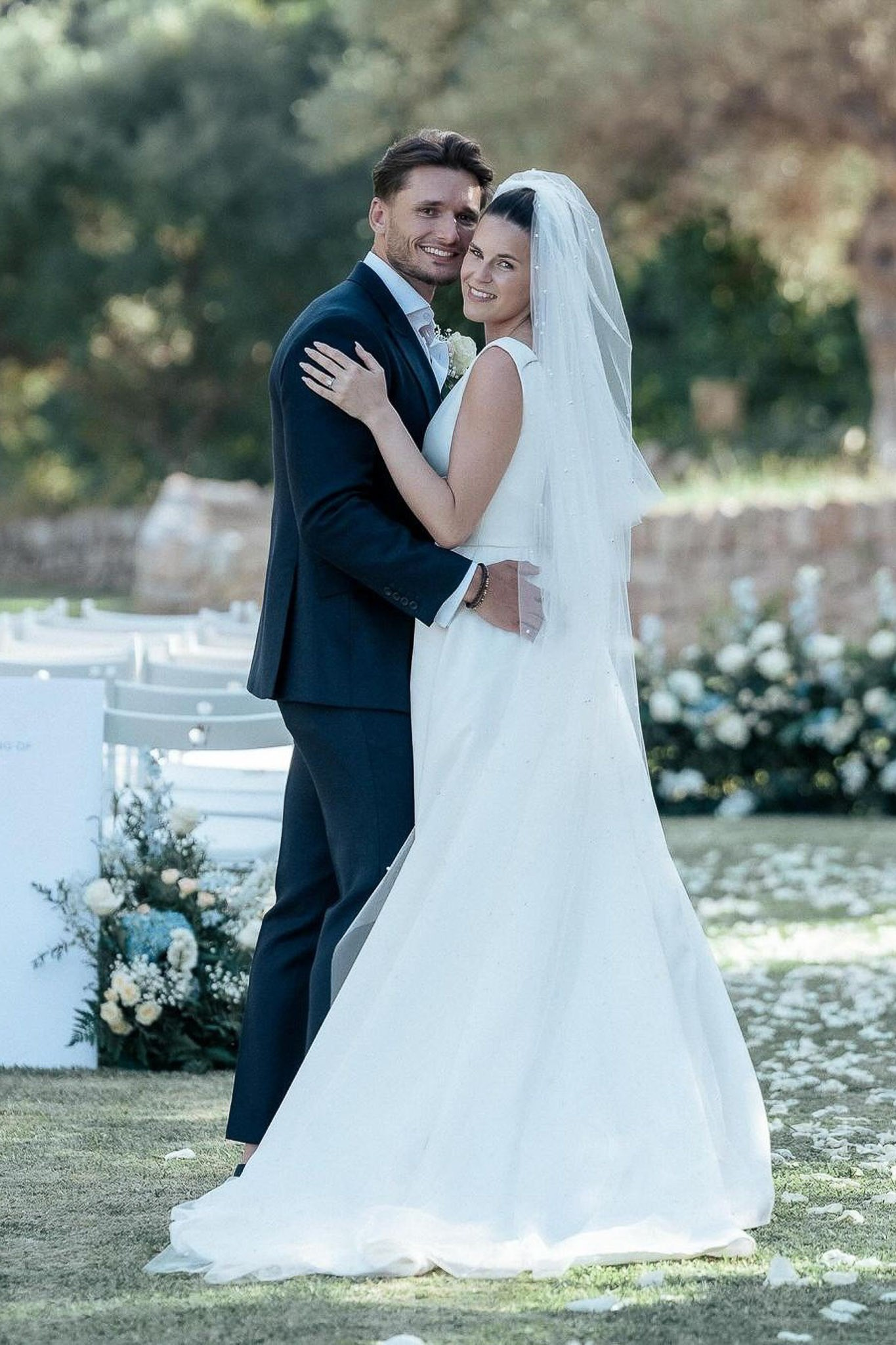 Bride and groom embracing and smiling at their wedding ceremony in Mallorca