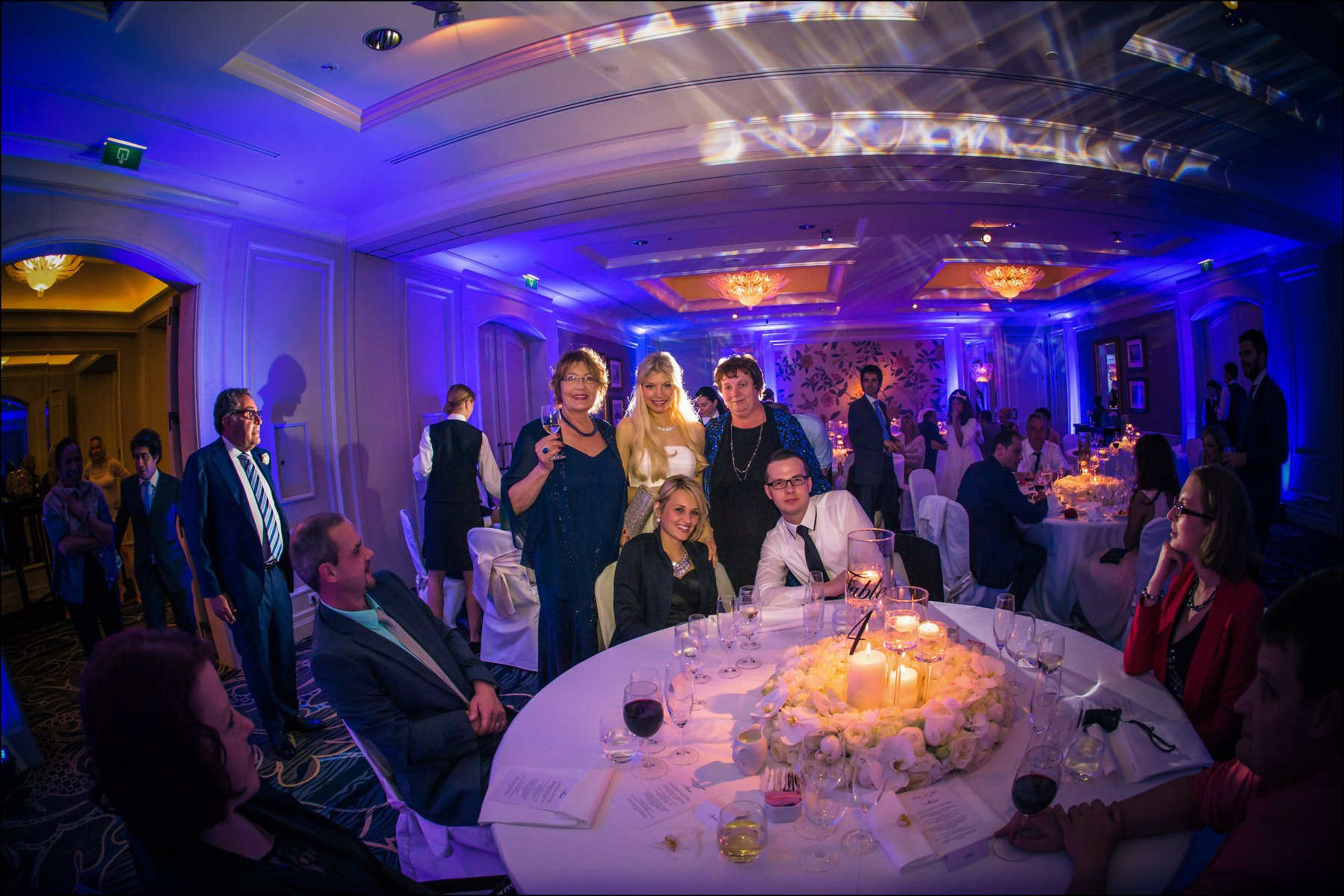 Bride with family and guests table photos Four Seasons Prague reception