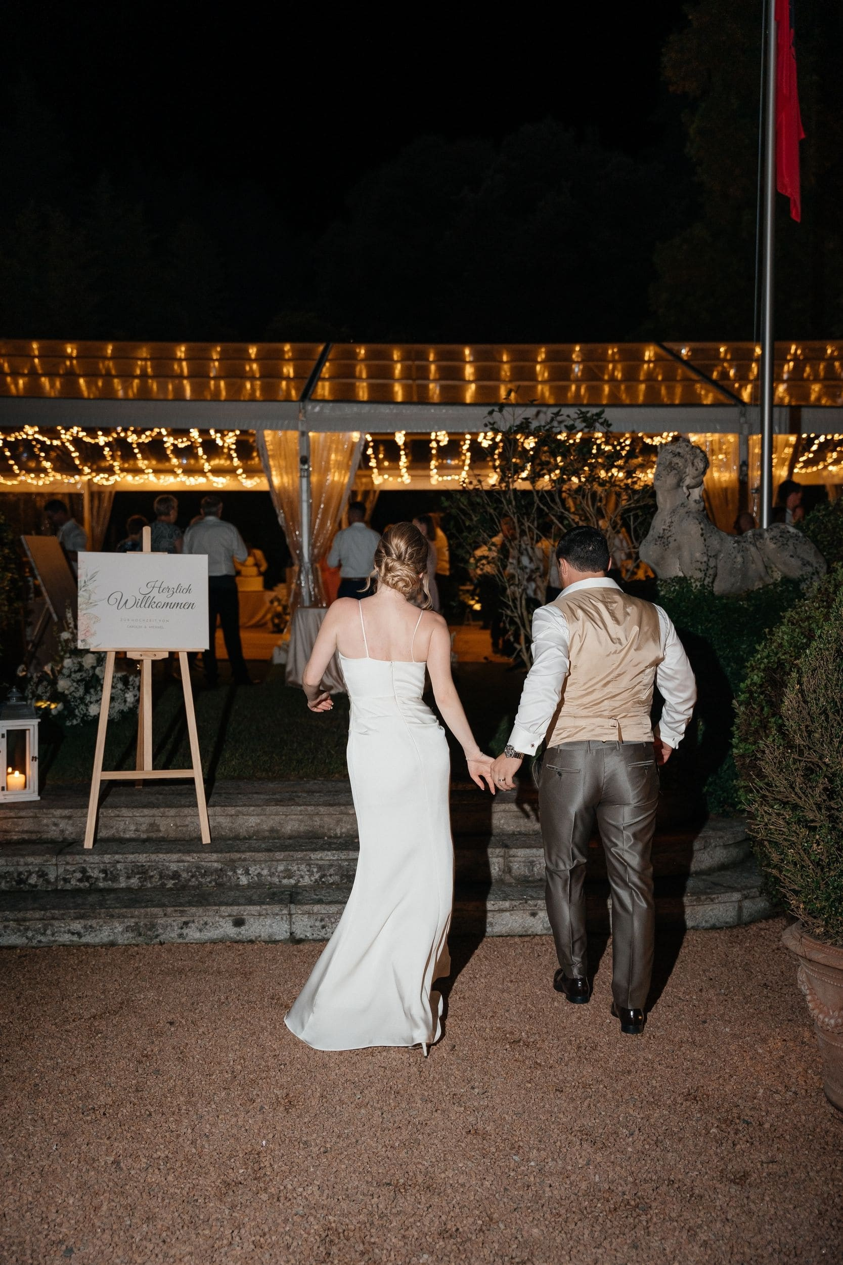 bride and groom entering wedding party