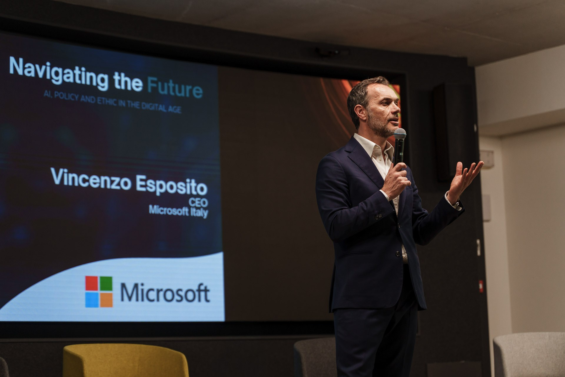 Corporate conference speaker photographed during a business event in Milan