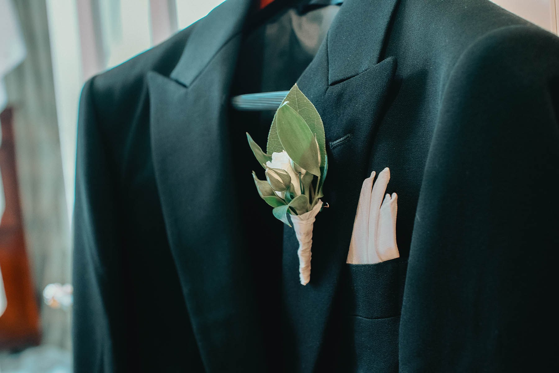 The groom's stylish suit.