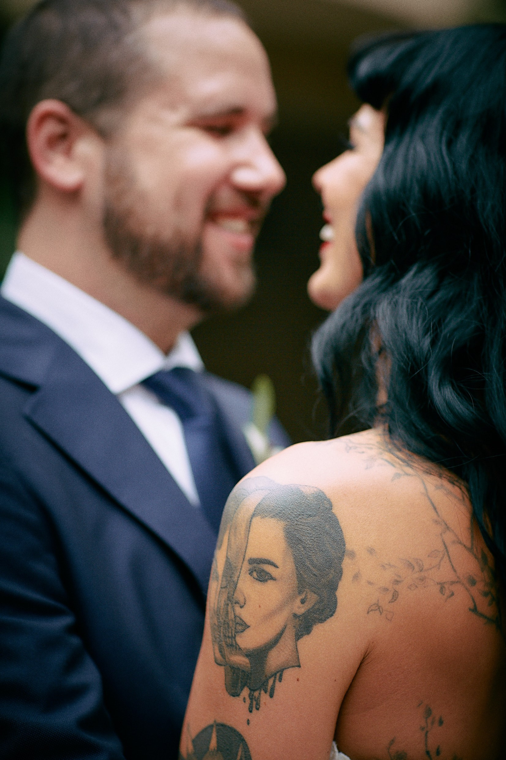 Detailed close-up of burlesque bride's distinctive tattoos.