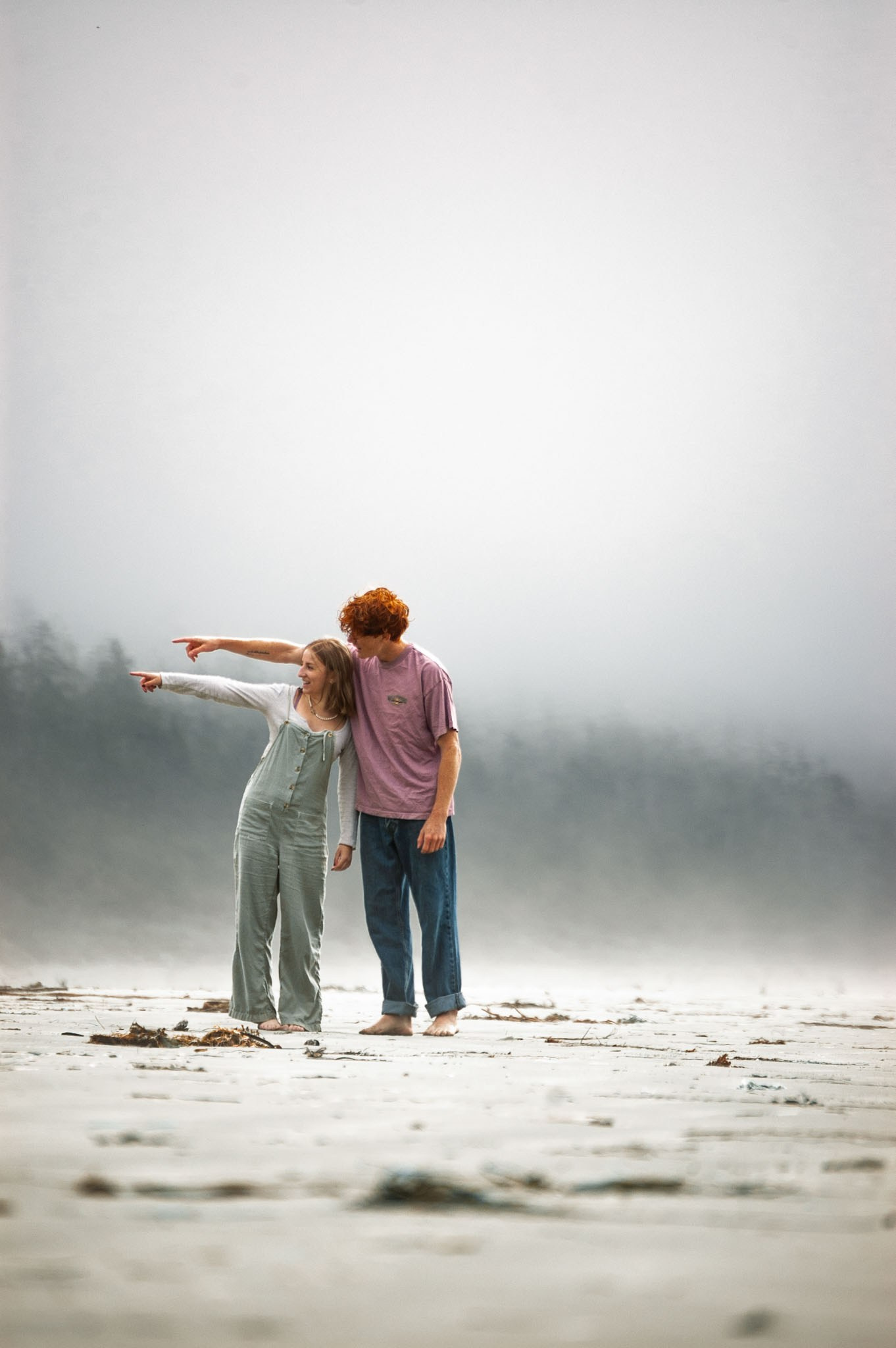Couple walking together during a cinematic love story photoshoot in Courtenay