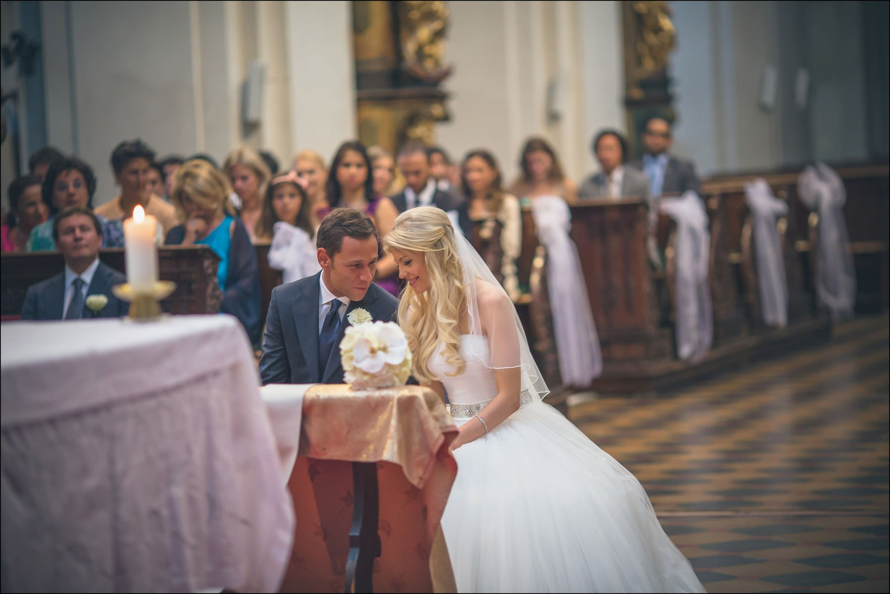 Couple whispering tenderly during wedding ceremony St. Thomas Prague