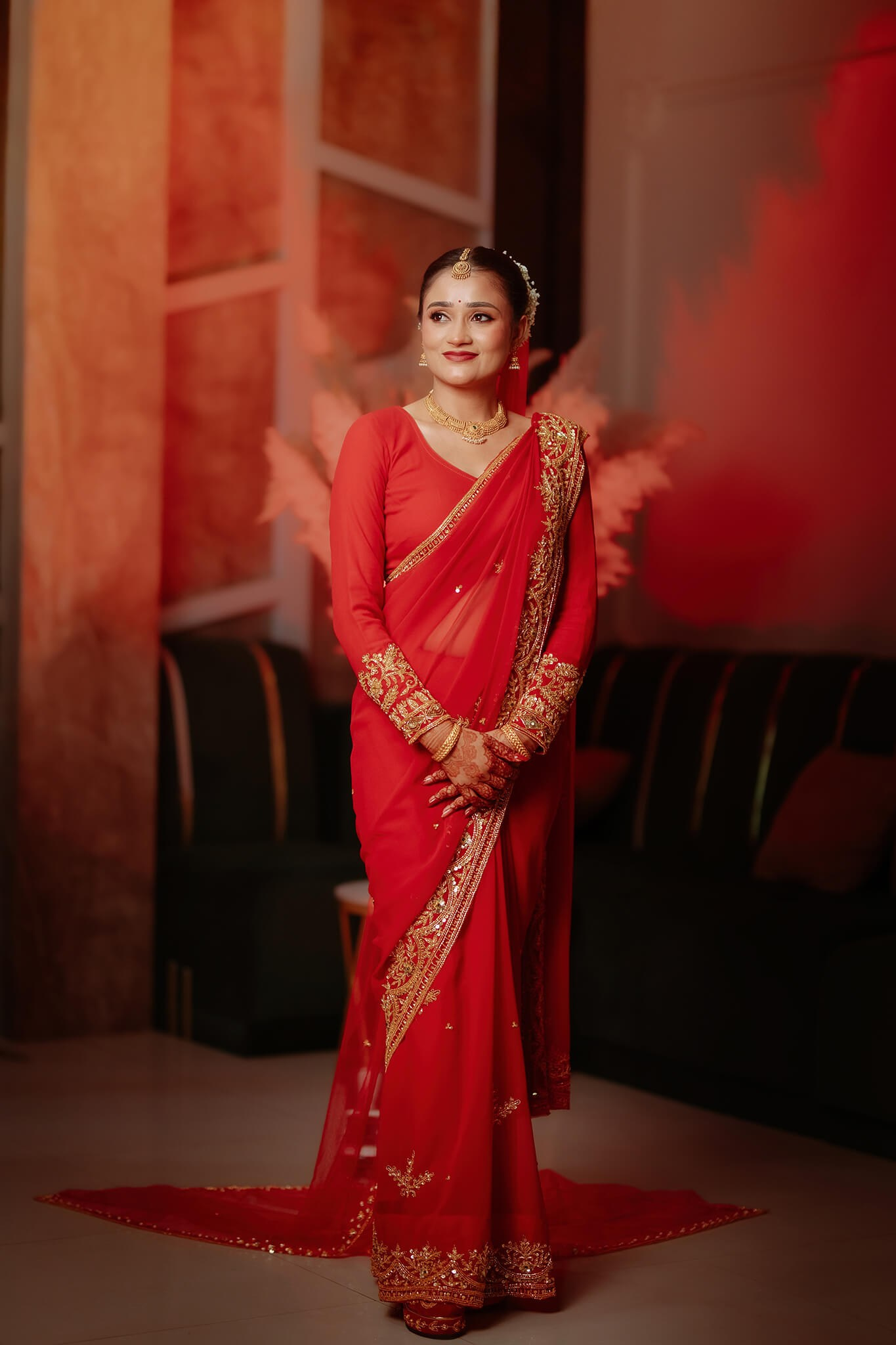 Beautiful Nepali bride portrait in traditional red wedding attire in Kathmandu