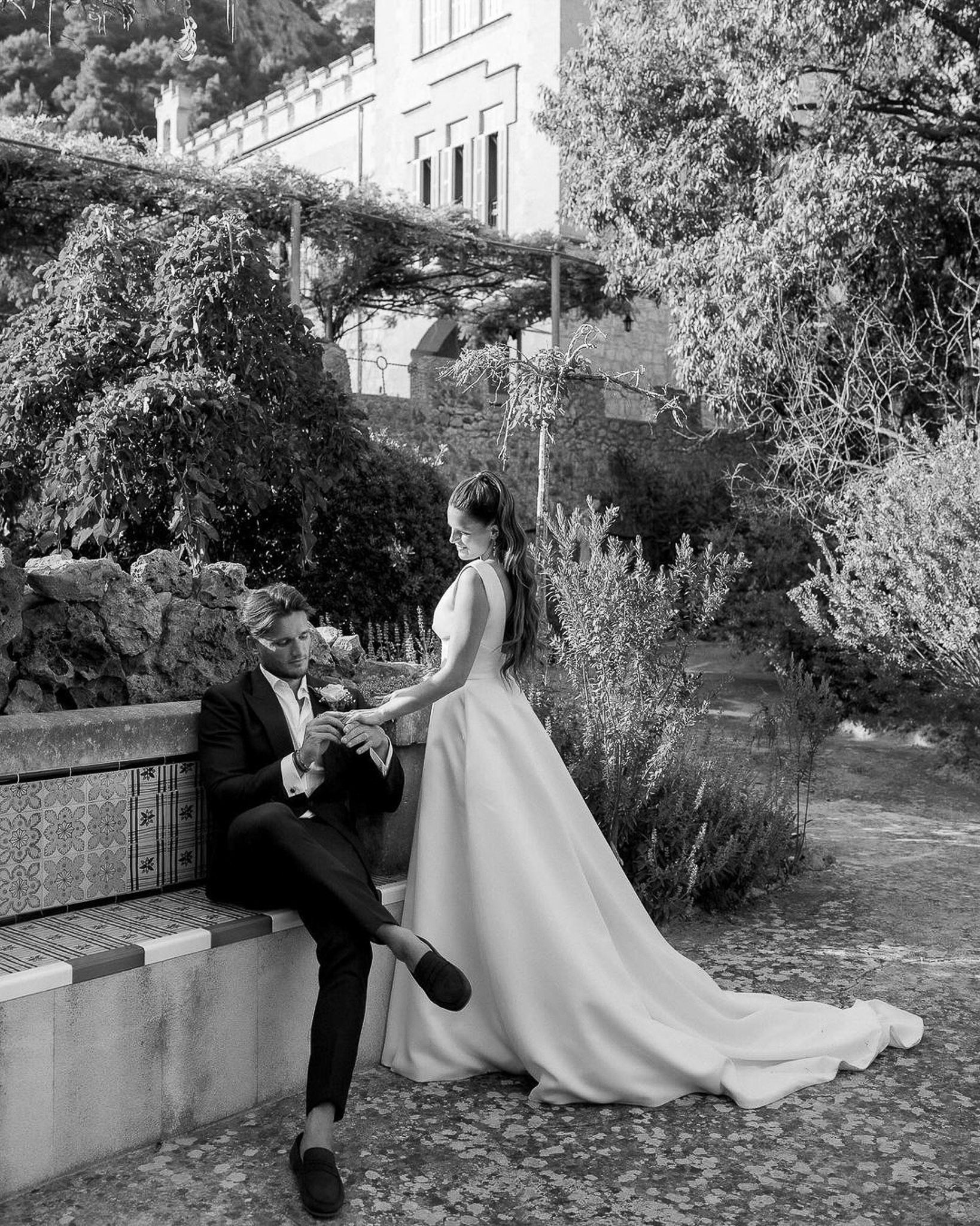 Bride and groom sharing a quiet moment on a tiled bench at their Alqueria Blanca wedding