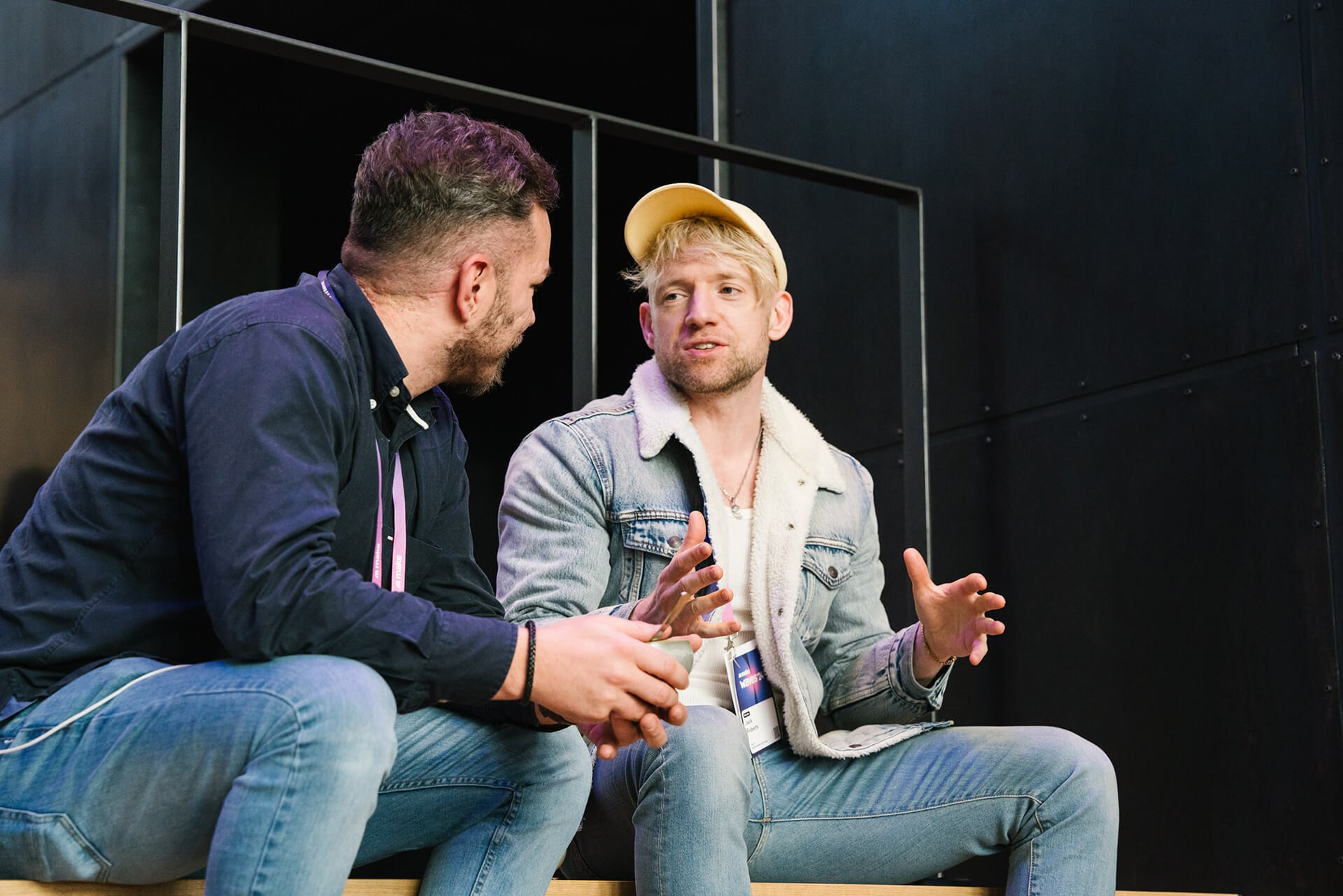 Informal one-on-one meeting between two attendees at a corporate gathering in the City of Berlin