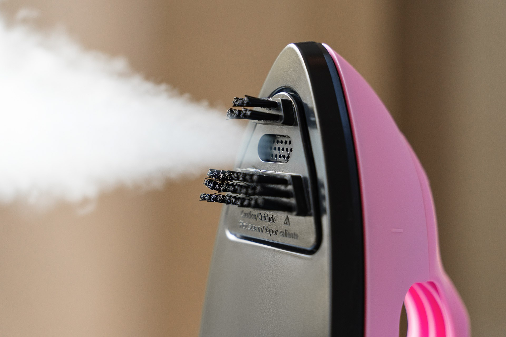 Close-up product photography of steam iron for appliance advertising campaign