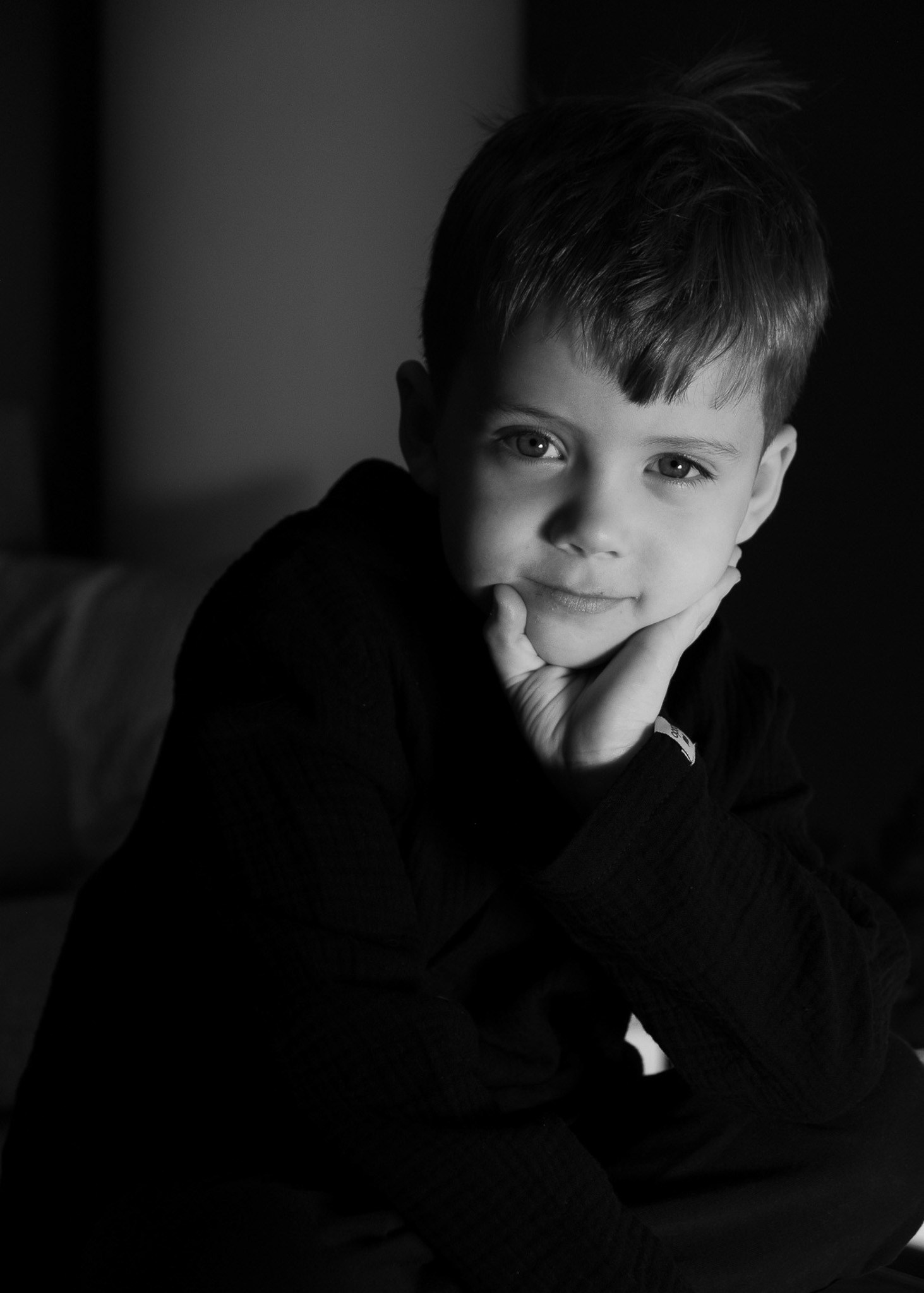 Creative black-and-white portrait with dramatic lighting.