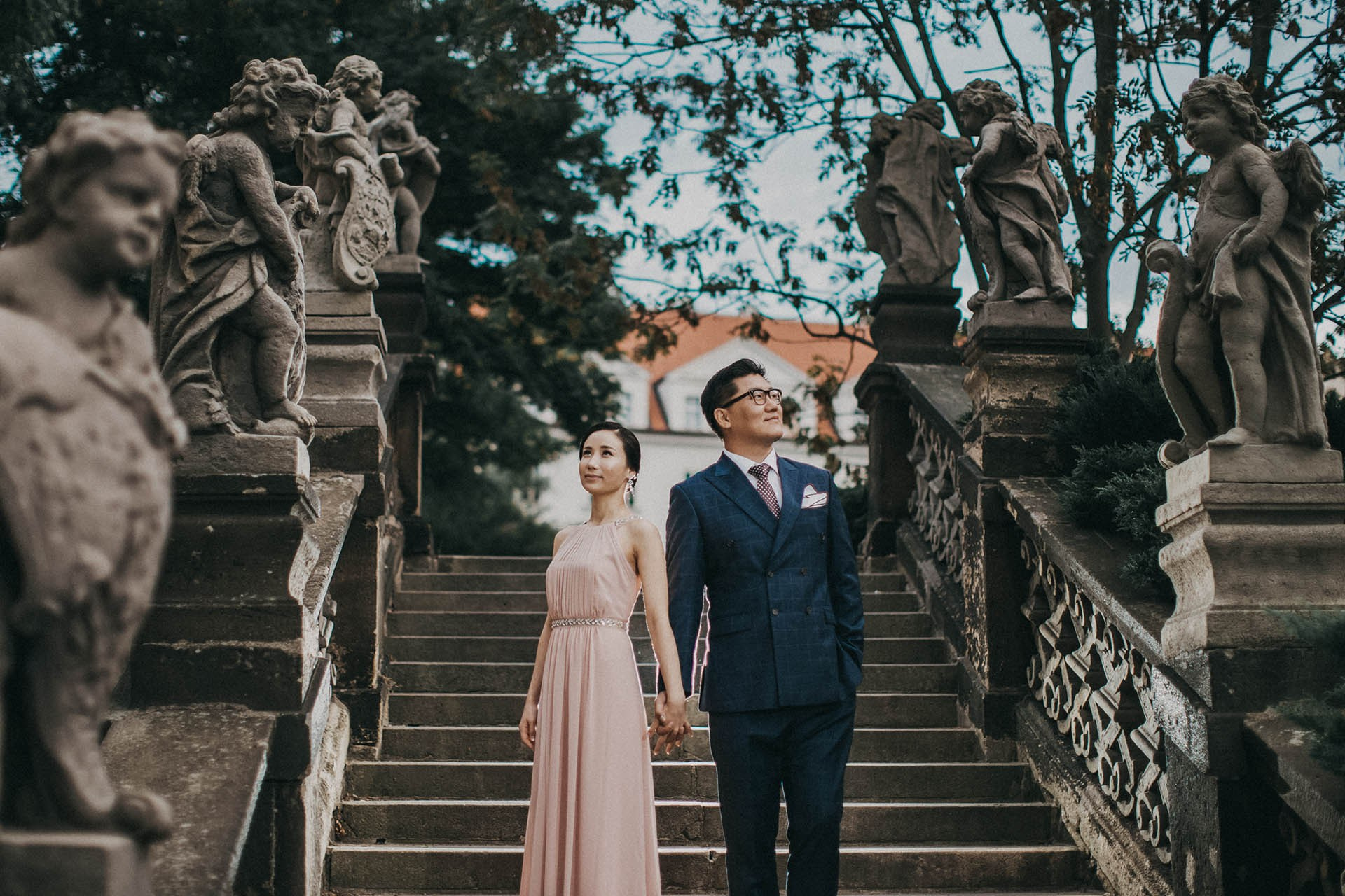 Catherine Cedric Son evening wear Loreta statues Prague Castle portrait.