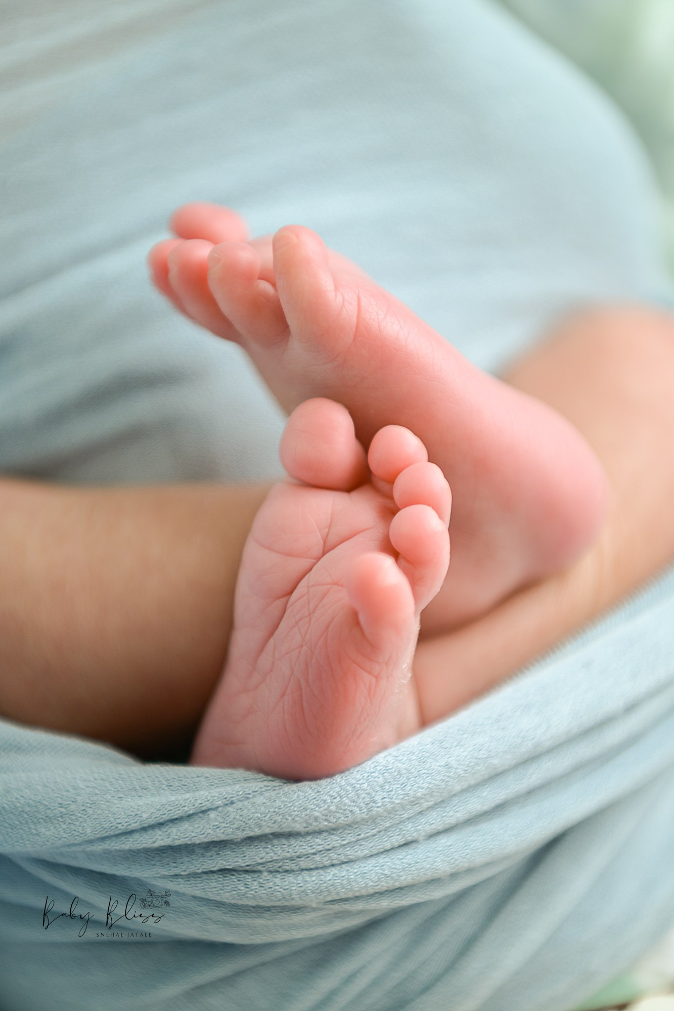 tiny feet and tiny toes of a newborn baby.