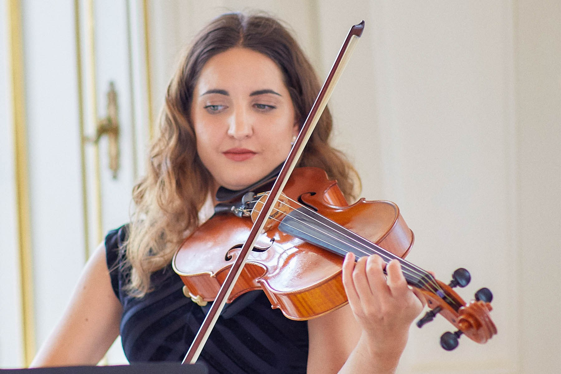 The violinist performs during the ceremony.